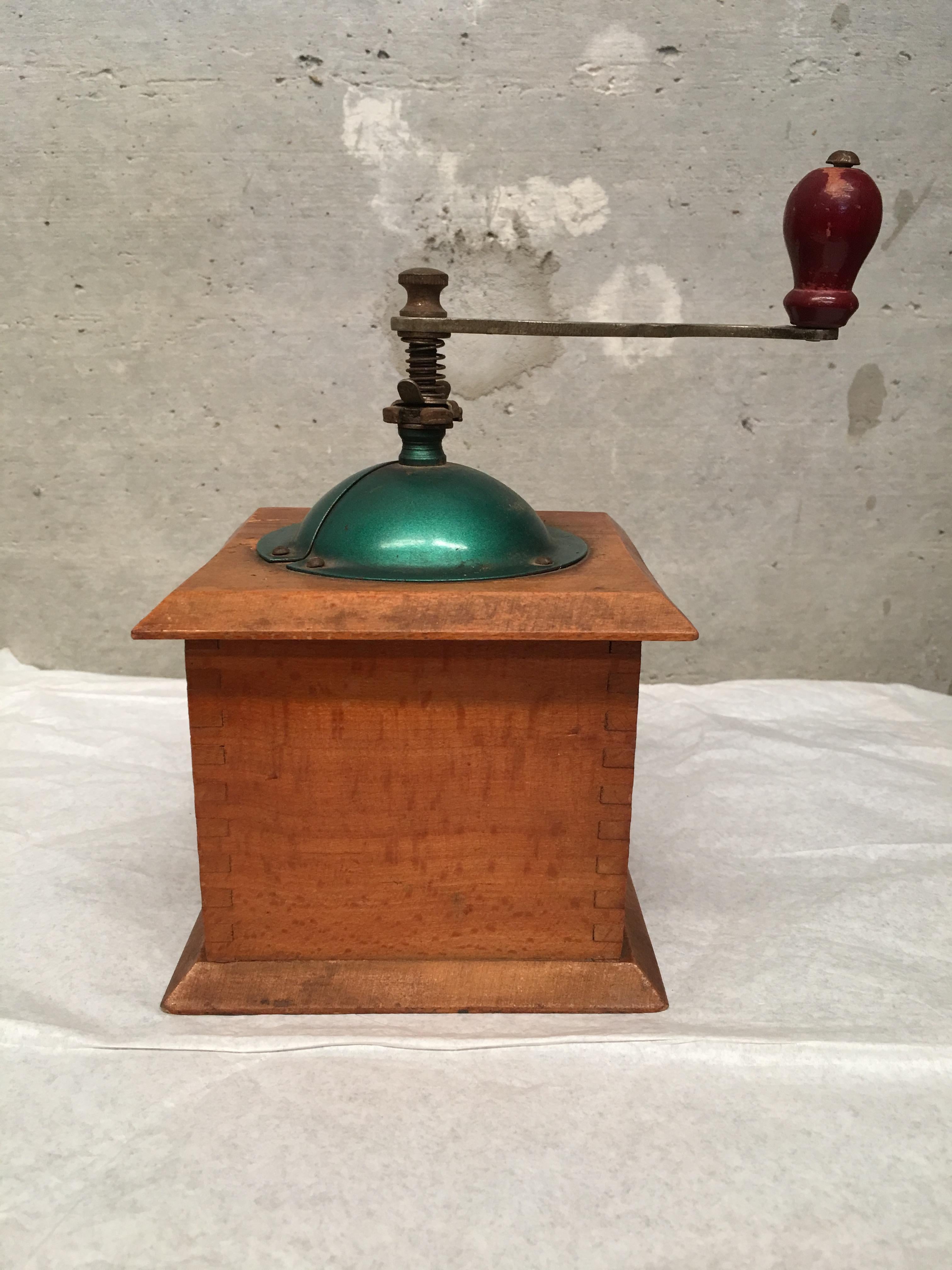 20th century coffee grinder with shaped top and treen handle.