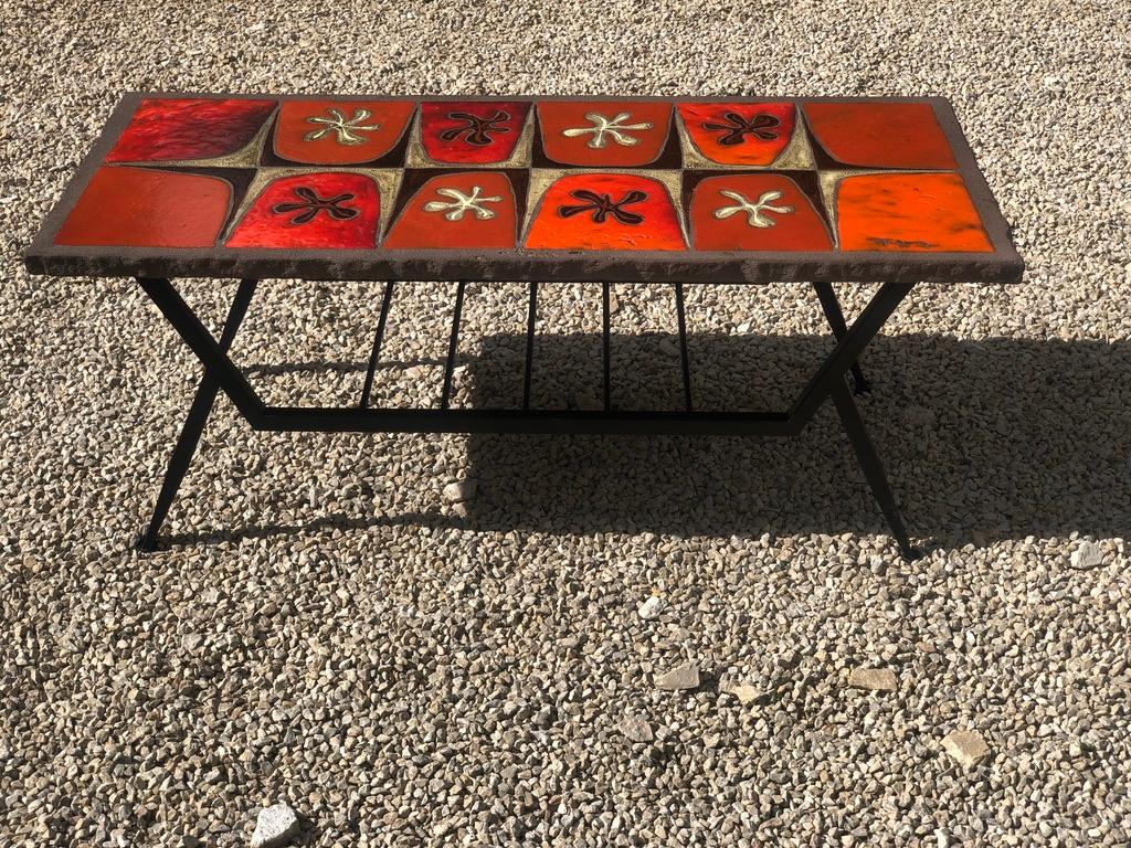 Jean Jaffeux coffee table in enamelled lava 1960 with geometric decorations in shades of red.