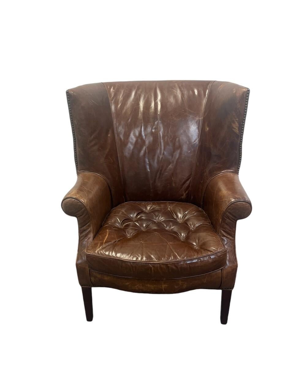 20th Century Cognac Leather Wingback Chair with distressed leather and nail head trim. A classic Lounge / Library Chair
Please observe the pictures for condition