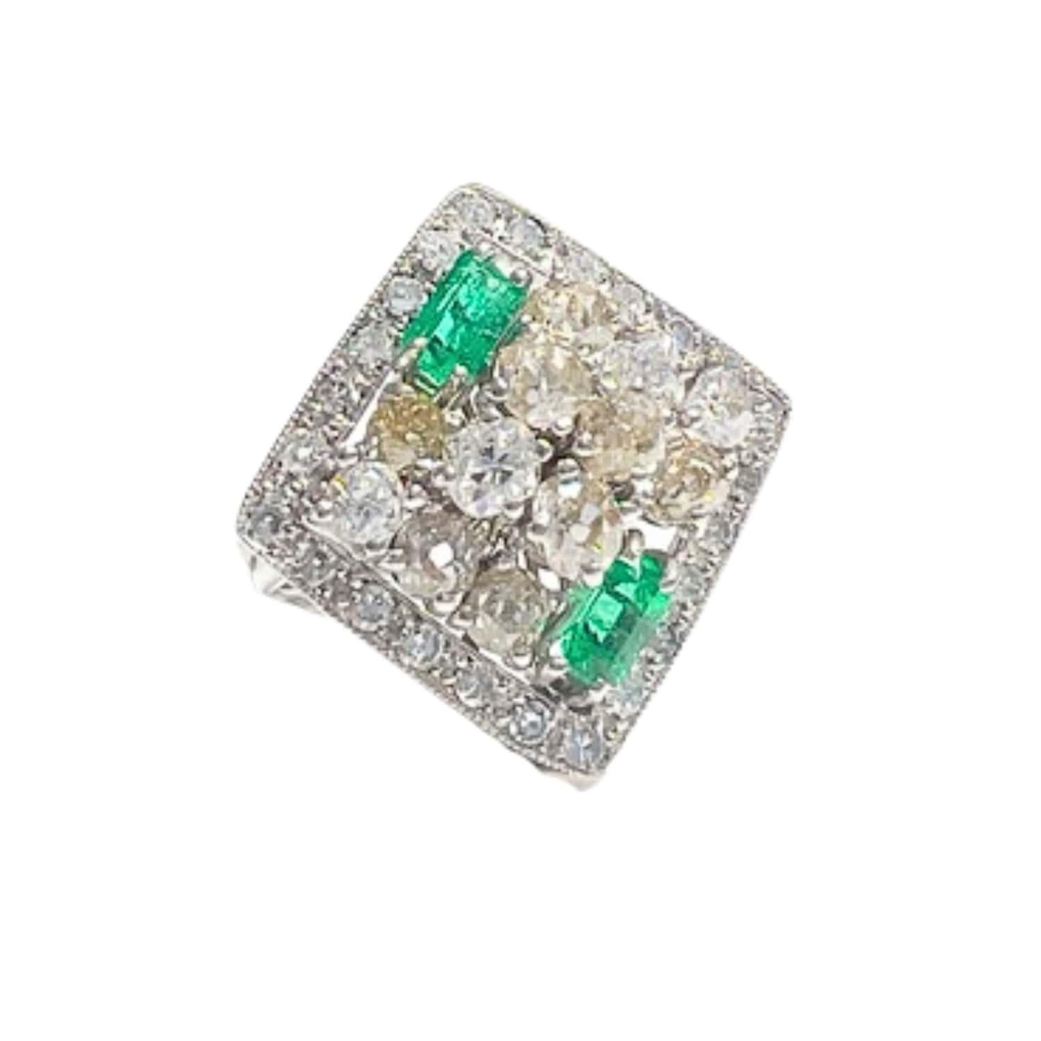 Elevate your style with this contemporary ring from the 20th century, crafted in 18k white gold and adorned with diamonds and emeralds. Featuring antique-cut diamonds 1,73 carats with VS-SI clarity and I-J color, as well as baguette-cut emeralds