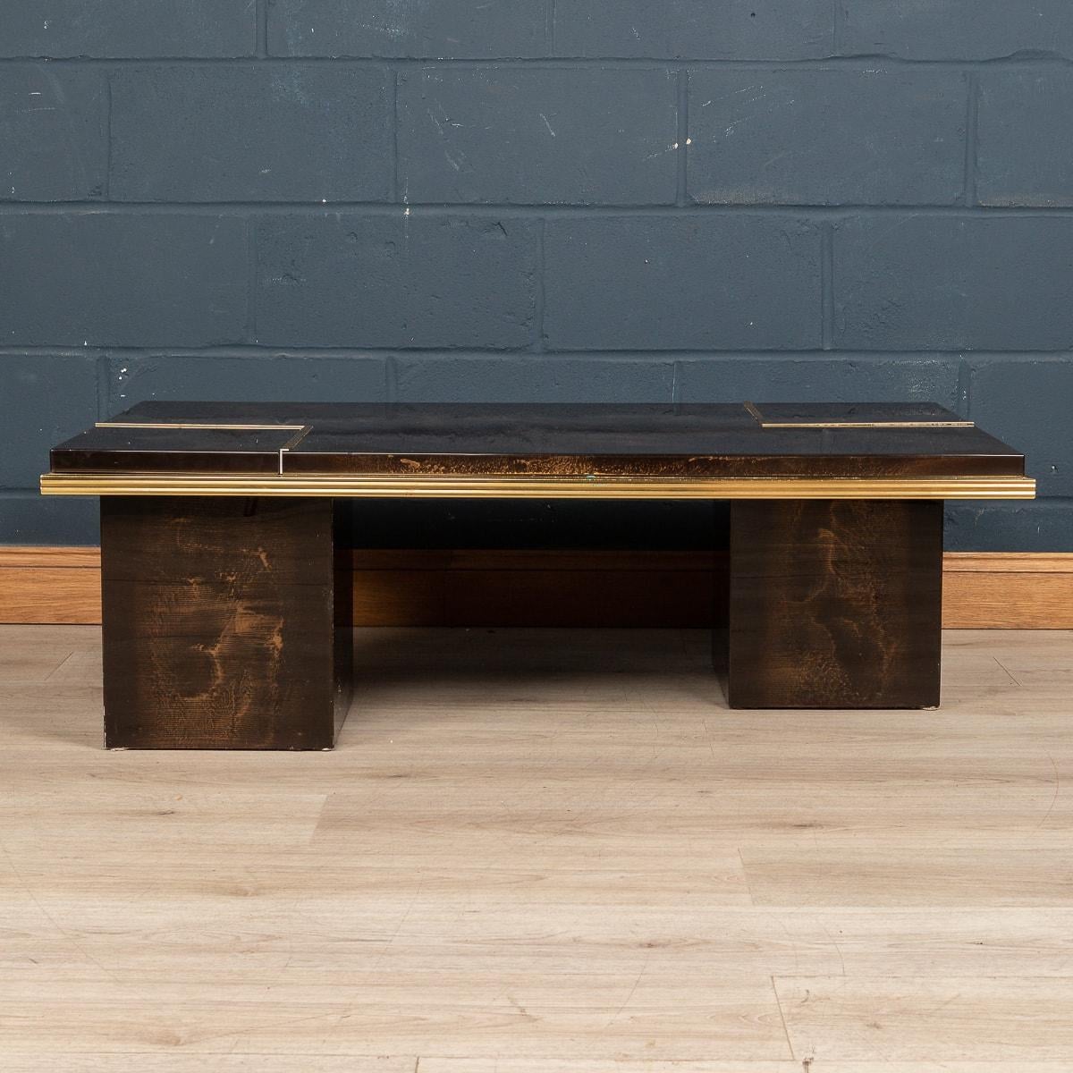 A most unusual “hidden bar“ coffee table made in the latter part of the 20th century. Likely to have been made in Italy or France, the clever design has the wonderful feature of two compartments that lift to reveal a hidden bar for drinks and