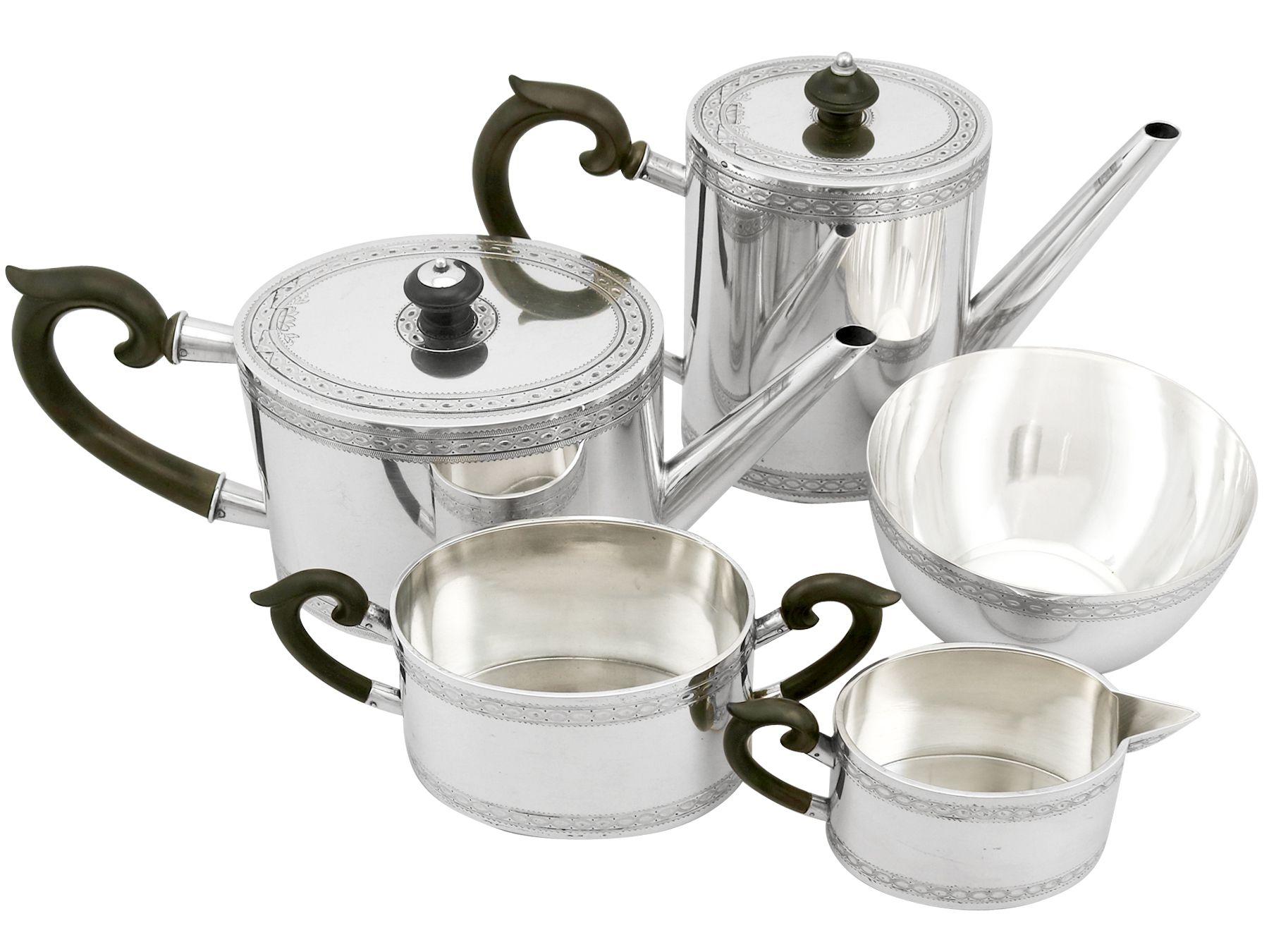 An exceptional, fine and impressive antique European sterling silver five-piece tea and coffee set/service; part of our silver teaware collection.

This exceptional antique European silver tea and coffee set consists of a coffee pot, teapot, cream