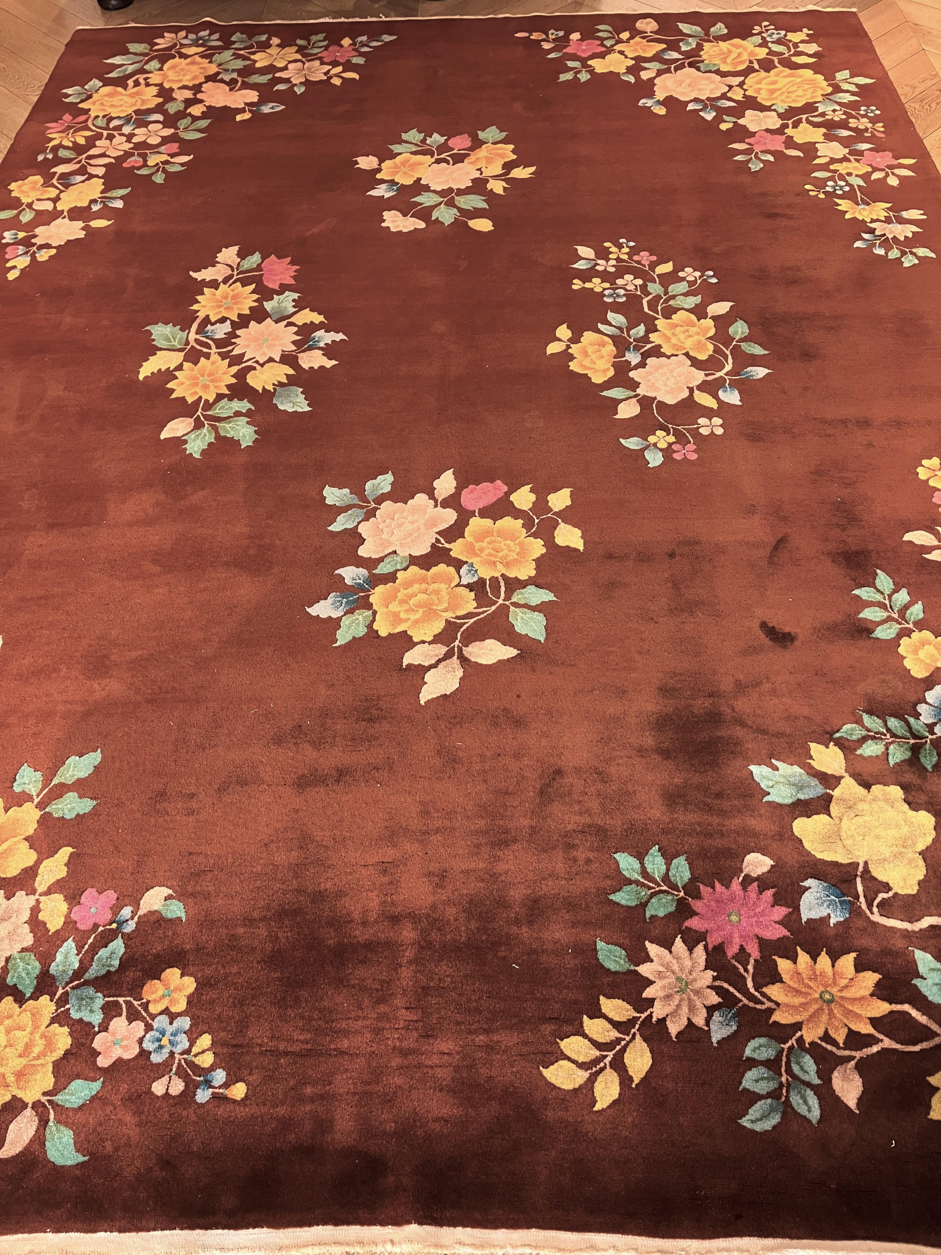 This beautiful Chinese carpet from the Art Deco period is distinguished by its elegance and unusual style. The wool is shiny, silky, and spun with greater thickness than normal Chinese wool. This type of carpet was born around the 20s on the