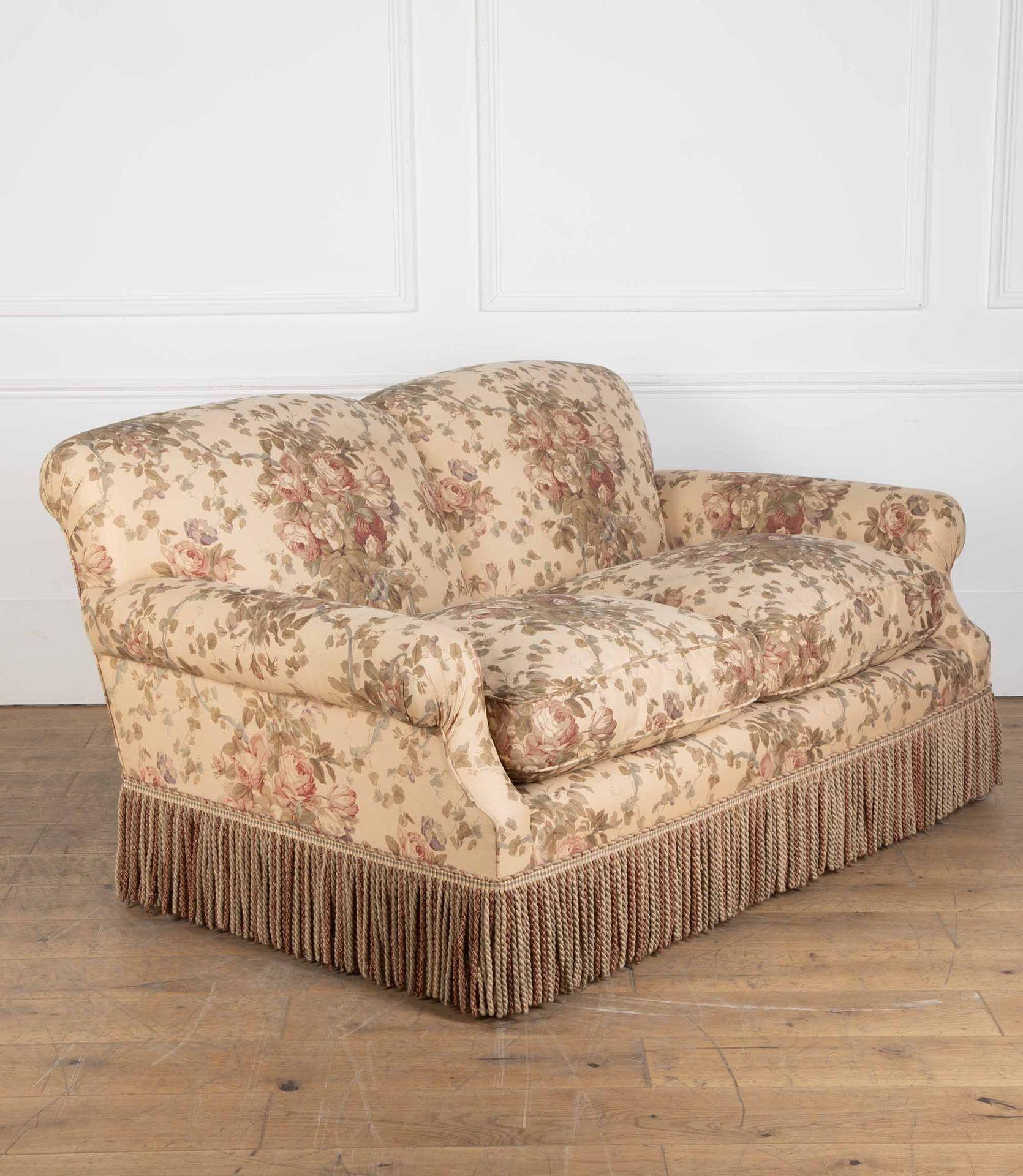 Handmade 20th Century sofa with heavy feather cushions.

With a deep seat and upholstered in Bennison classic Roses fabric, with a bullion fringe by samual & sons.