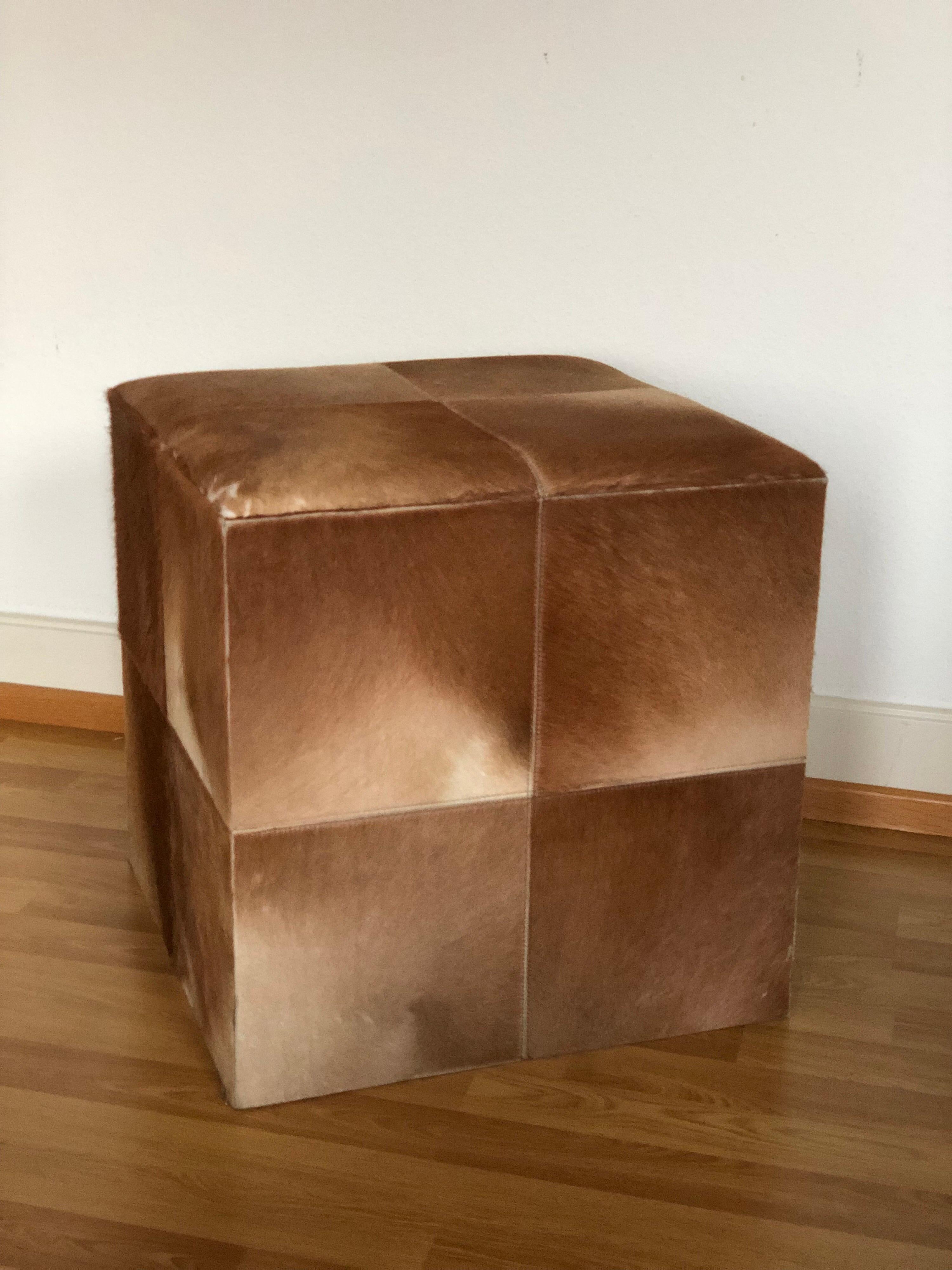 Cowhide cube ottoman or pour in very good condition,
circa 1990.