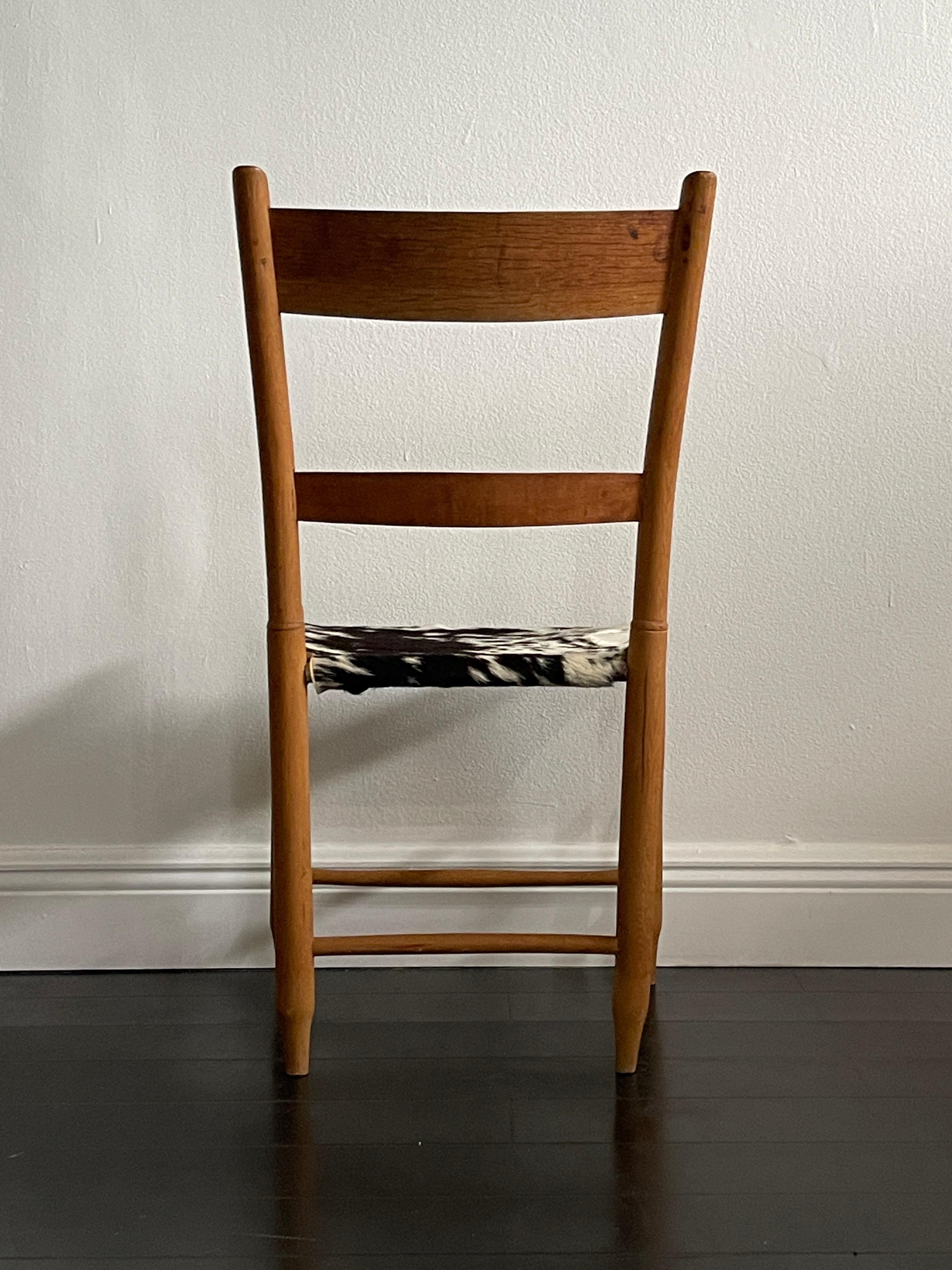 Hand-Crafted 20th Century Cowhide Ladder Back Chair For Sale