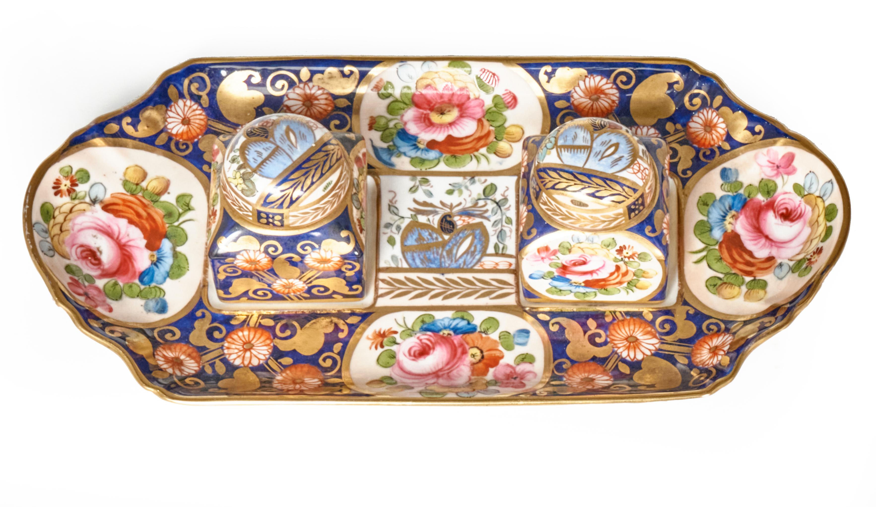 Beautiful and complete desk set by Crown Staffordshire, England dating to the first part of the 20th Century. It includes the hand painted tray with 2 covered ink wells with their liners. The set is skillfully decorated with cobalt blue, gold and