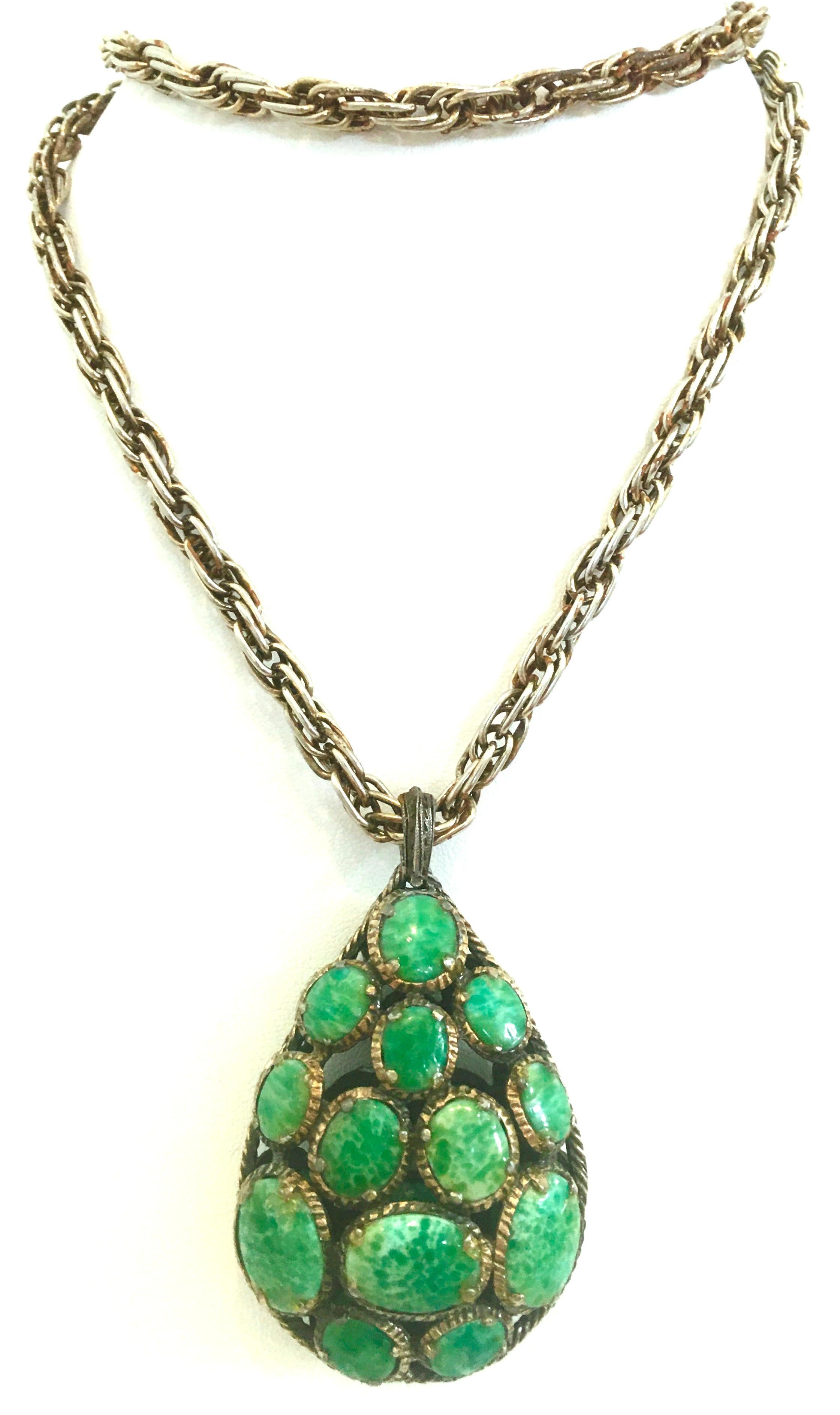 20th Century Crown Trifari Silver Plate & Faux Turquoise Locket Style Pendant Necklace. This rare and coveted piece features a silver rope style chain link necklace and monumental in size locket style green faux turquoise stone pendant. The pendant
