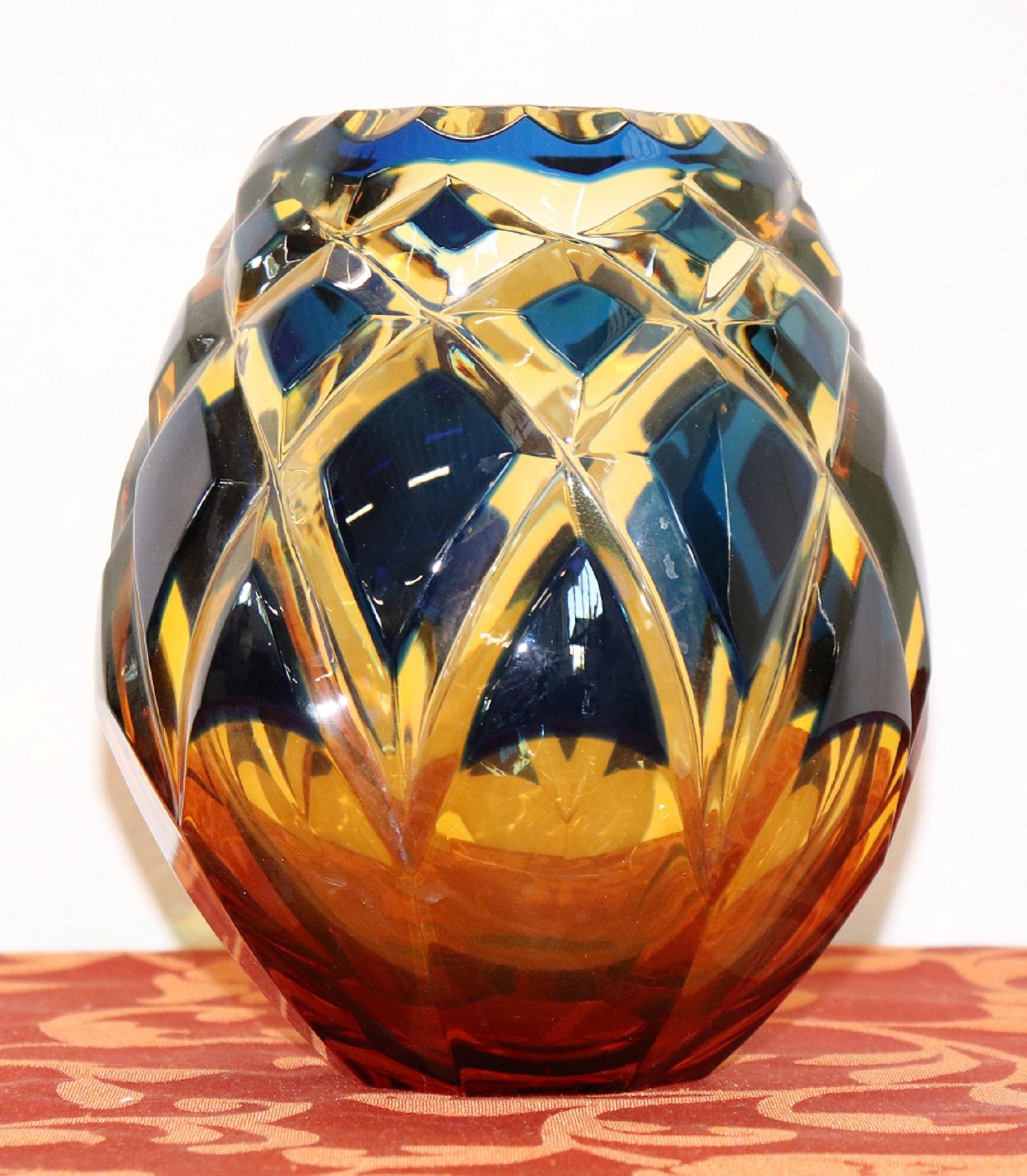 Refined crystal vase in blue and amber decorated with rhombs. Signed Agarthi.