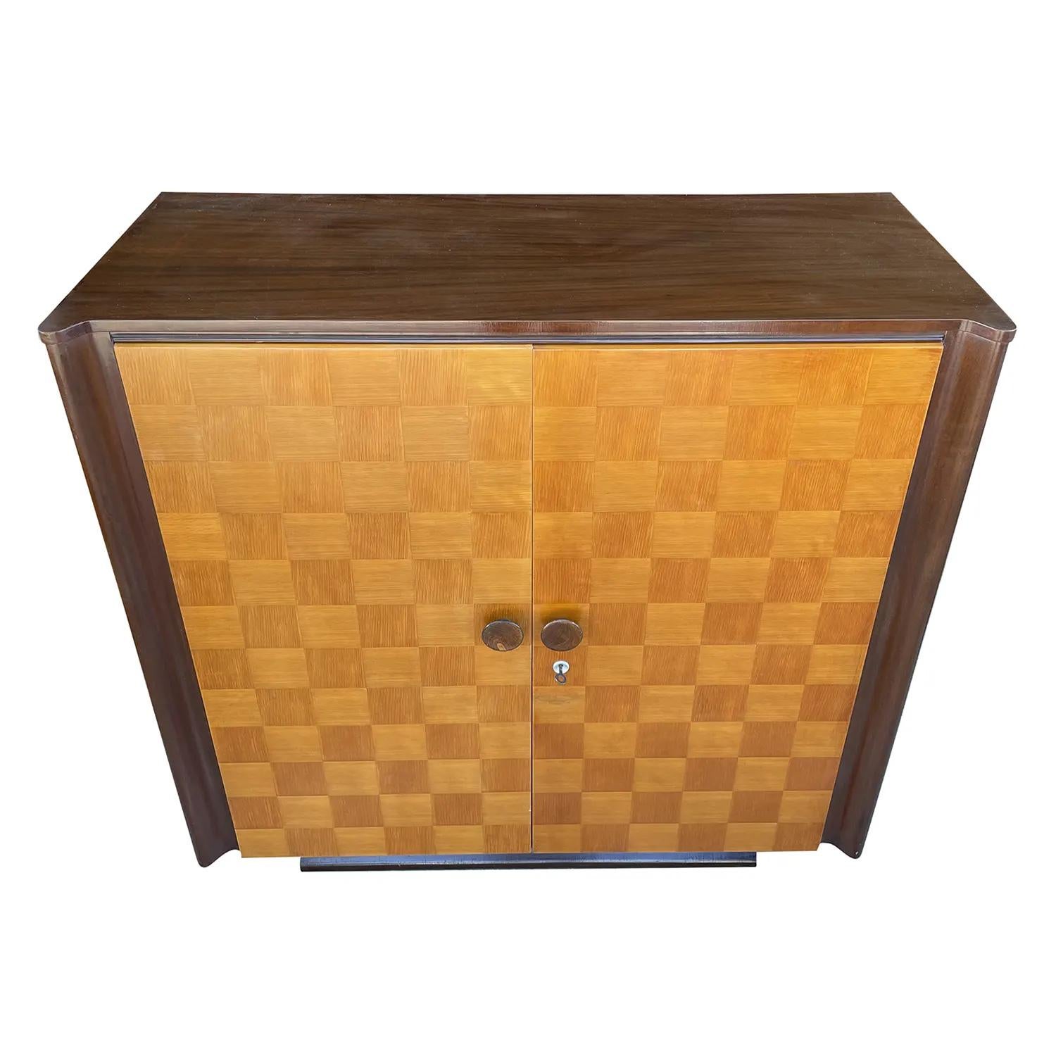 A light-brown, vintage Art Deco Czech sideboard, cabinet made of hand crafted Mahogany and Pinewood, in the style of Jindrich Halabala in good condition. The cupboard is composed with two doors and round polished door handles, pulls. The interior of