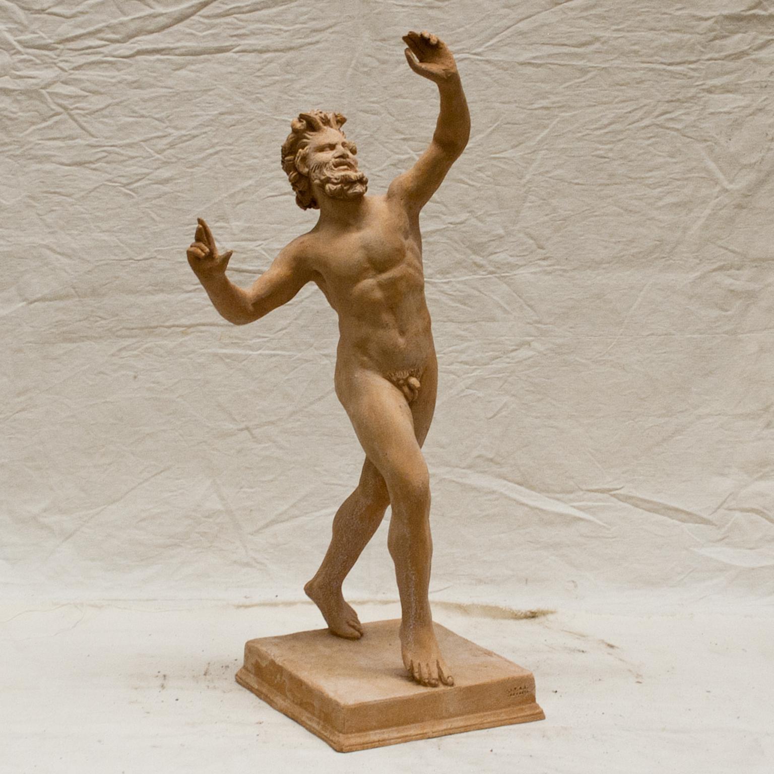 A vintage Italian terracotta clay statuette of the famous dancing Faun or Satyr which is well known in the Hellenistic and Roman art, in good condition. The original was placed in the House of the Faun in Pompeii, which was one of the largest and