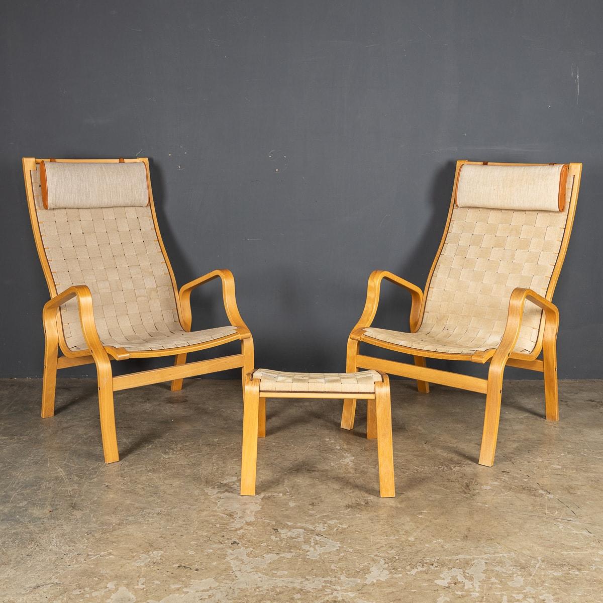 A Pair of lounge chairs designed in 1938 by Bruno Mathssen but not finalised until ten years later and finally named the Eva Arm Chair in 1978 when it had evolved into a more upright and streamlined object of beauty.

Created in solid Birch and
