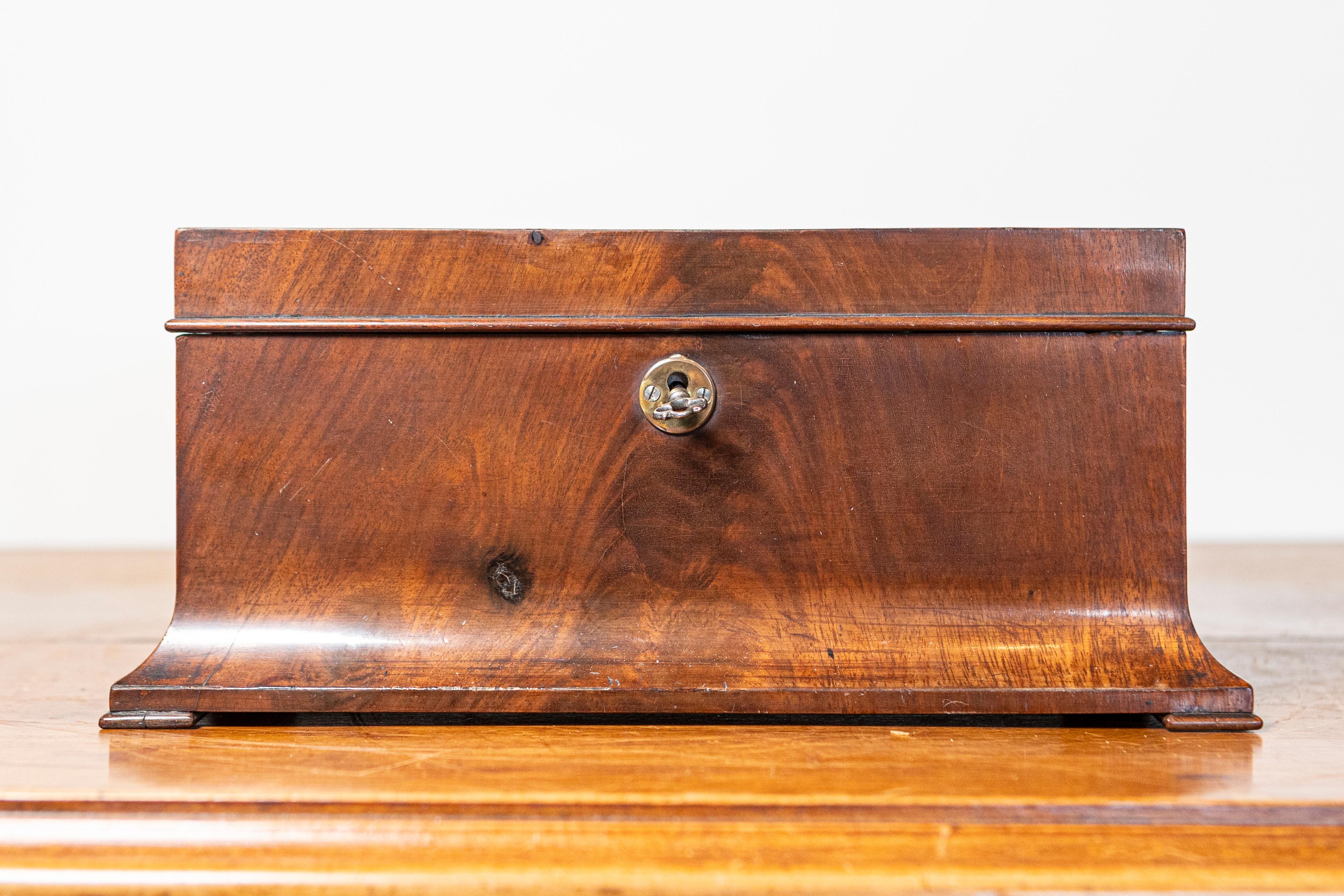 This elegant 20th-century Danish box, dating to circa 1900, is a stunning example of early 20th-century Scandinavian craftsmanship. Made from beautifully grained walnut, the box features a rich, polished finish that accentuates the natural warmth