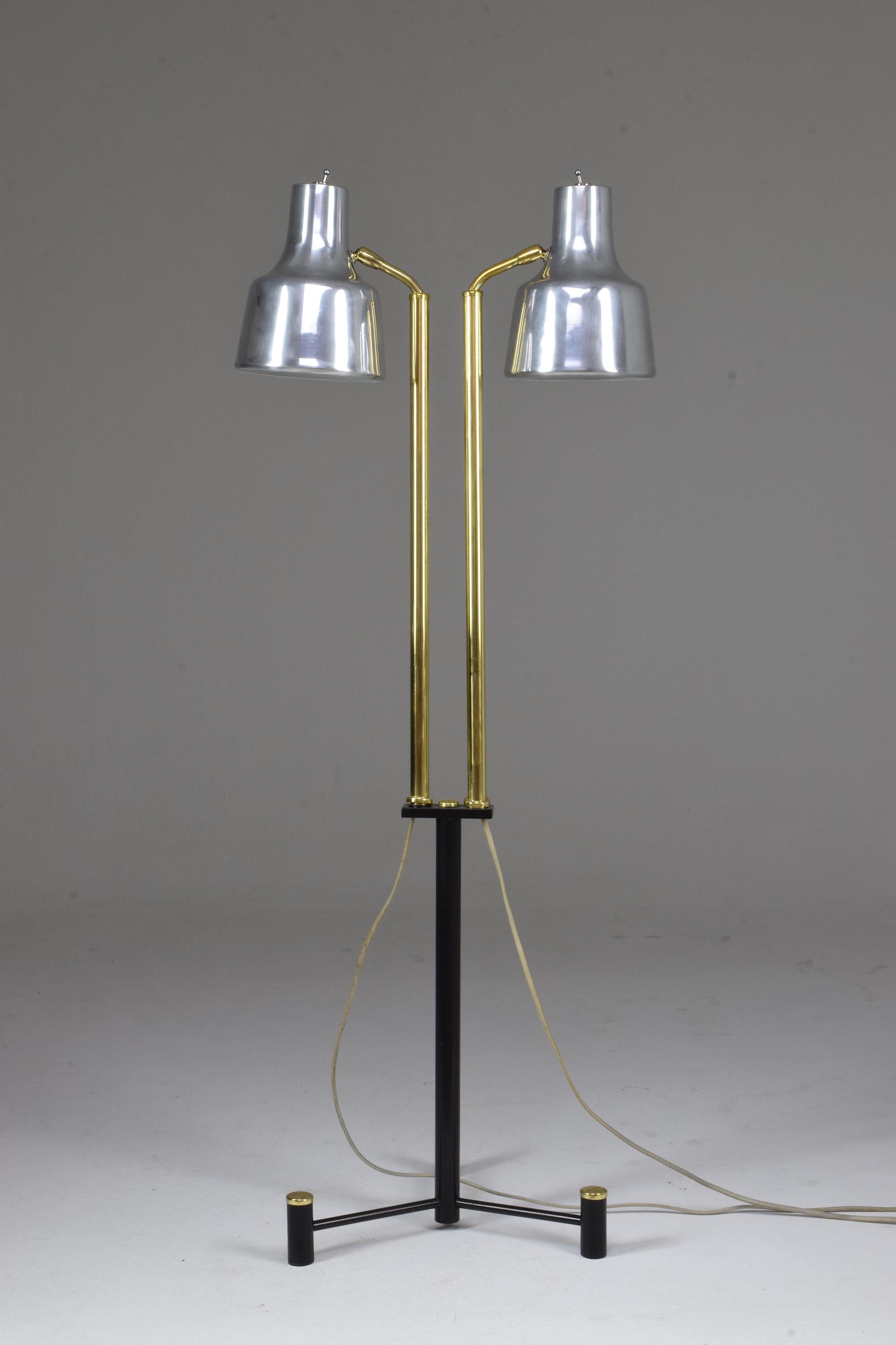 A midcentury vintage striking Scandinavian floor lamp by Fog & Morup designed with two standing steel floor lamps with adjustable brass arms and articulating aluminum shades. 
Denmark, circa 1960s. 

All our pieces are fully restored at our