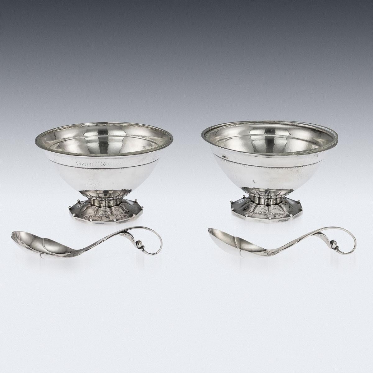 Antique early 20th century very rare Danish solid silver Georg Jensen pair of berry bowl and spoons, of traditional form, standing on a short foot with leaf decorated on a beaded polygon base, with two matching elaborate berry spoons, bowls fitted