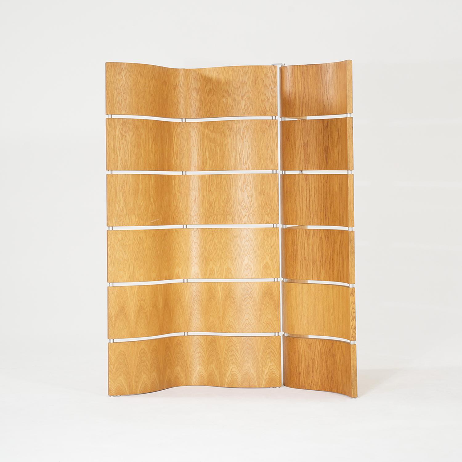 A sculptural, vintage Mid-Century modern Danish room divider made of hand crafted polished Birchwood, in good condition. The large Scandinavian screen has two adjustable, flexible wavy wooden panels which are supported by a painted chrome frame.