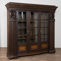 20th Century Danish Oak Display Cabinet with Carved Putti and Beveled Glass