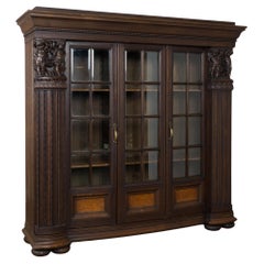 20th Century Danish Oak Display Cabinet with Carved Putti and Beveled Glass