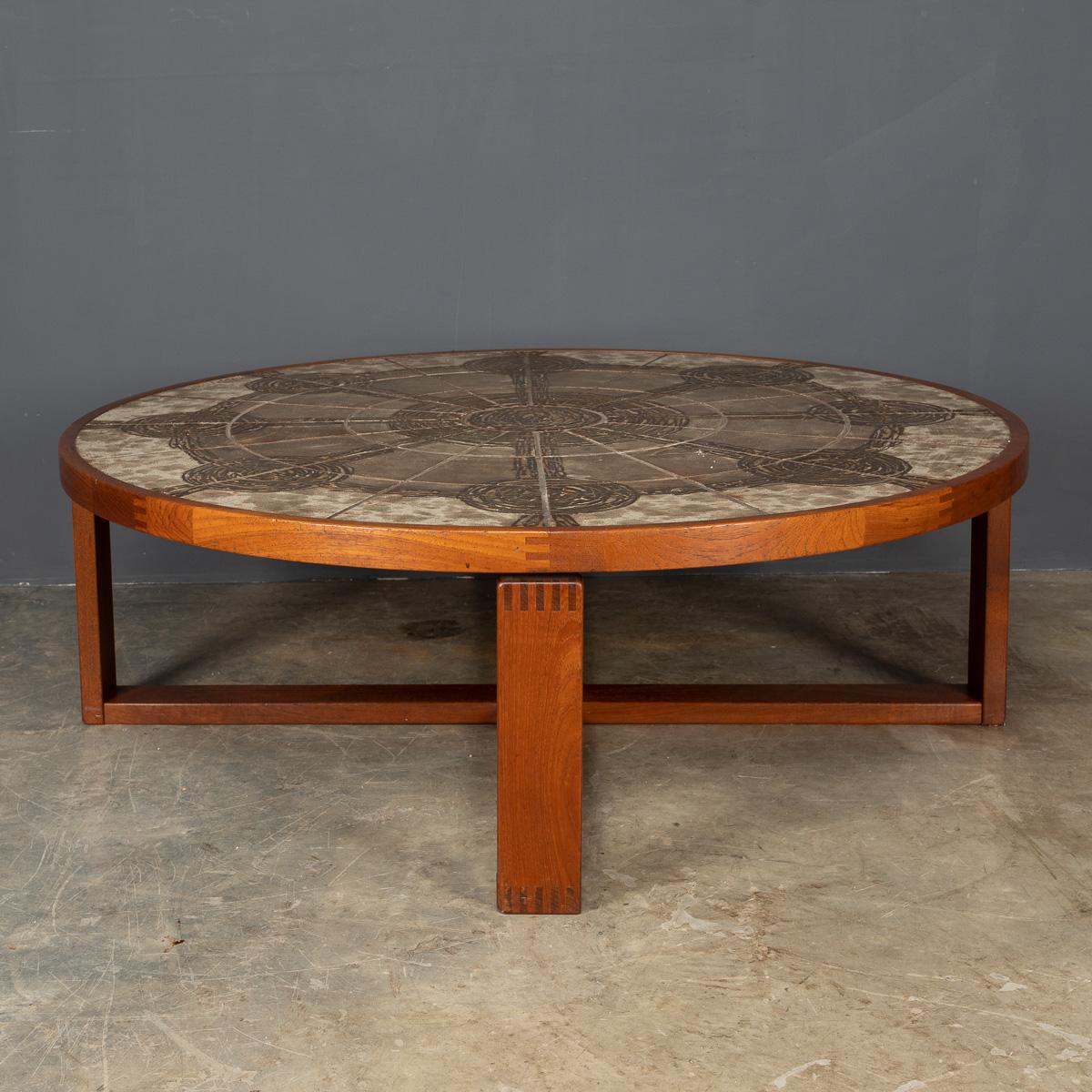 Stylish 20th century Danish Ox Art coffee table with teak frame and tiled top. Ox Art signature and date ‘74, produced by Danish company Trioh.

Condition
In great condition - wear consistent with age.

Size
Height: 42cm
Diameter: 125cm.