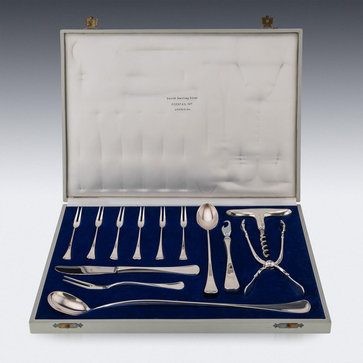 Mid-20th Century Danish solid silver bar cutlery and accesories, comprising of lemon forks, mixing spoons, bottle openers and ice tongs, comes in its original presentation box. Hallmarked Danish sterling silver (925 standard), Maker W&S Sorensen,