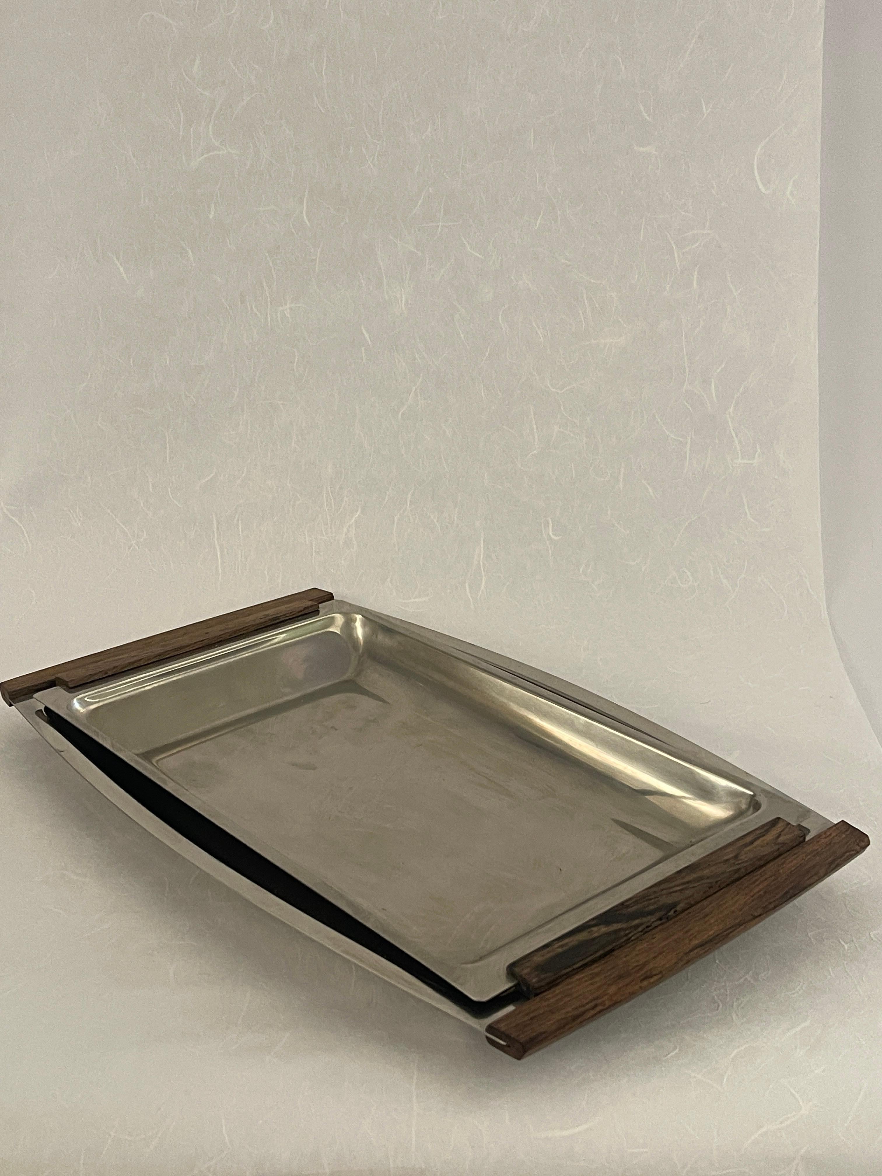 20th Century Danish stainless steel serving trays with teak handles. Two beautiful trays stamped 