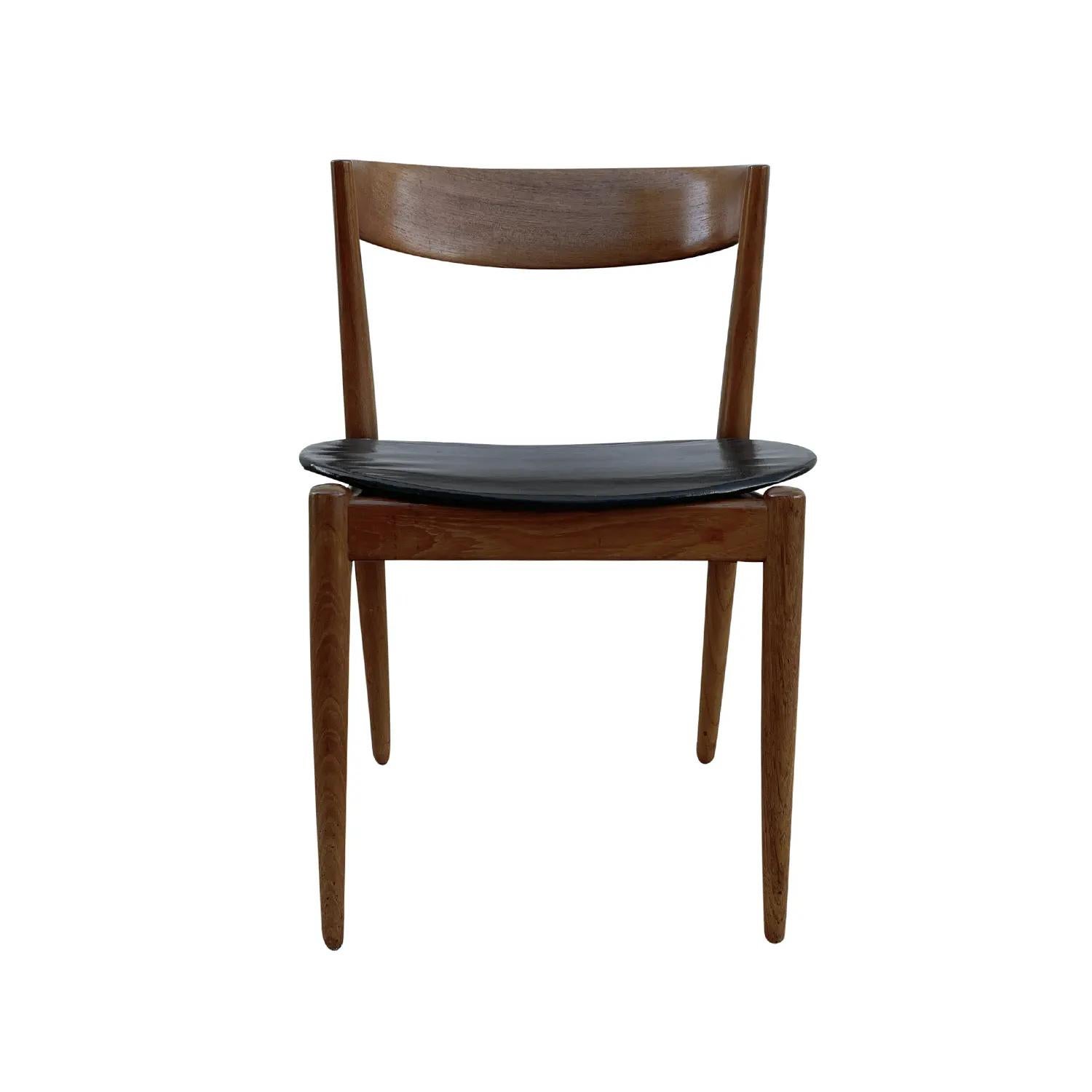 A dark-brown, vintage Mid-Century Modern Danish side chair made of hand crafted polished Teakwood, in good condition. The Scandinavian corner, end chair has a curved slim backrest, standing on four wooden legs. The seat cover is made of black faux