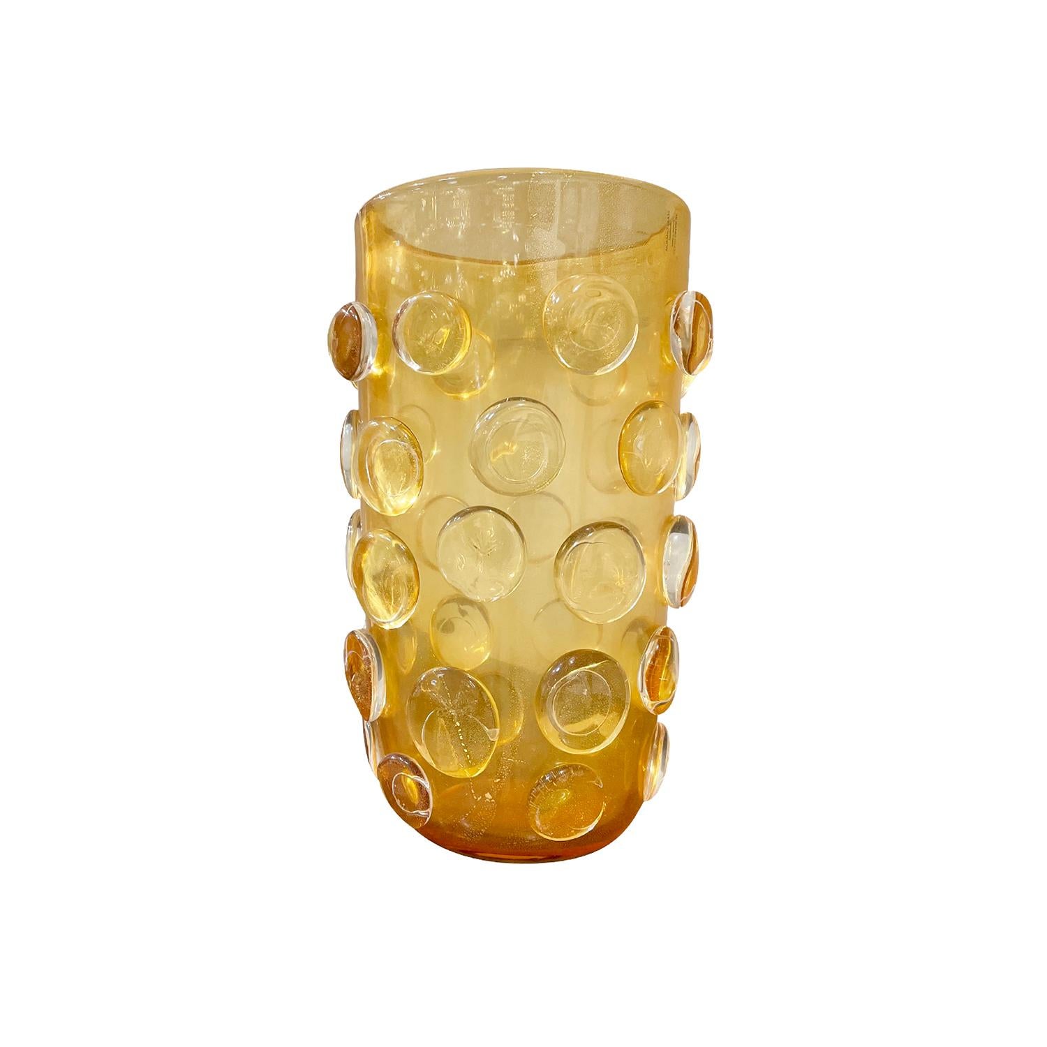 A dark-yellow, vintage Mid-Century Modern Italian single vase made of hand blown colored Murano glass, in good condition. The décor piece is enhanced by detailed bubbles. Wear consistent with age and use, circa 1940-1960, Venice, Italy.