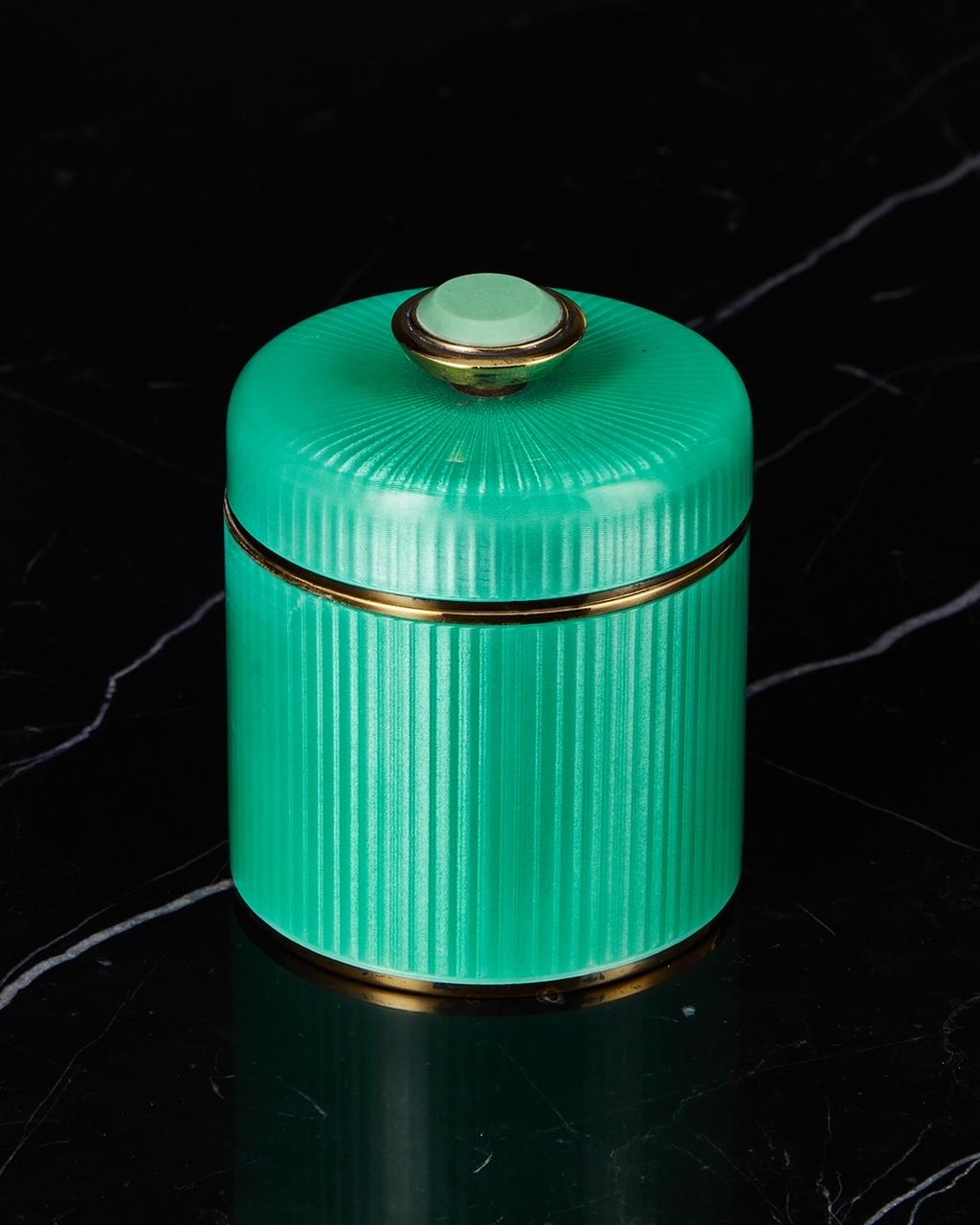 A wonderful 20th Century David Andersen Silver & Guilloche Enamel box with Lid Circa 1960.

A beautiful object in excellent condition. The translucent green enamel is of the highest quality and the lid flawlessly sits in position to give overall
