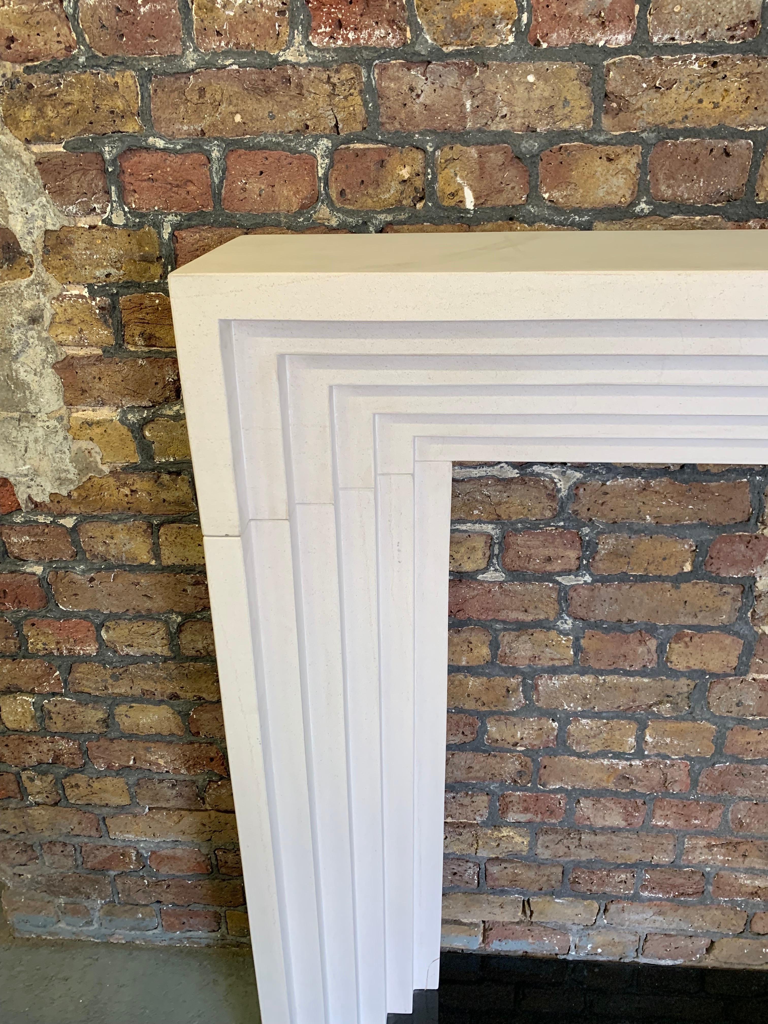 20th Century Deco Style Limestone Fireplace Mantlepiece.
Hand Carved With Stepped Detail With A Honed Finish.
Impressive Surround For Contemporary Feel.

Shelf Width 57 