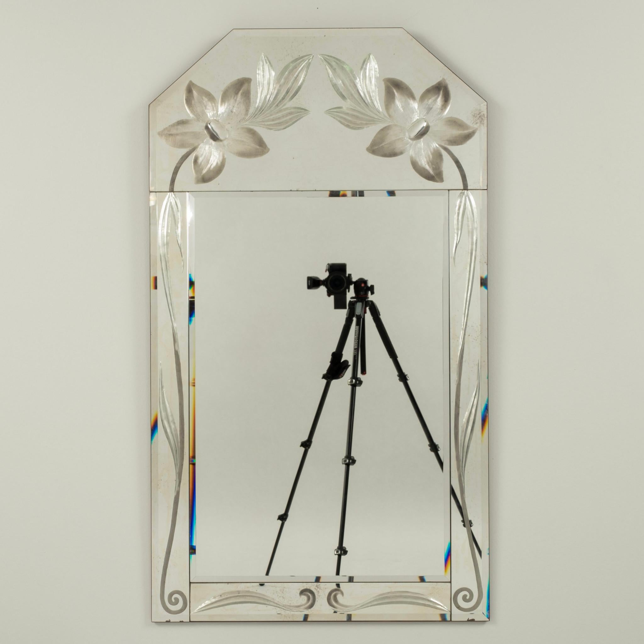 An Italian 20th Century Deco style floral and scrolled etched mirror