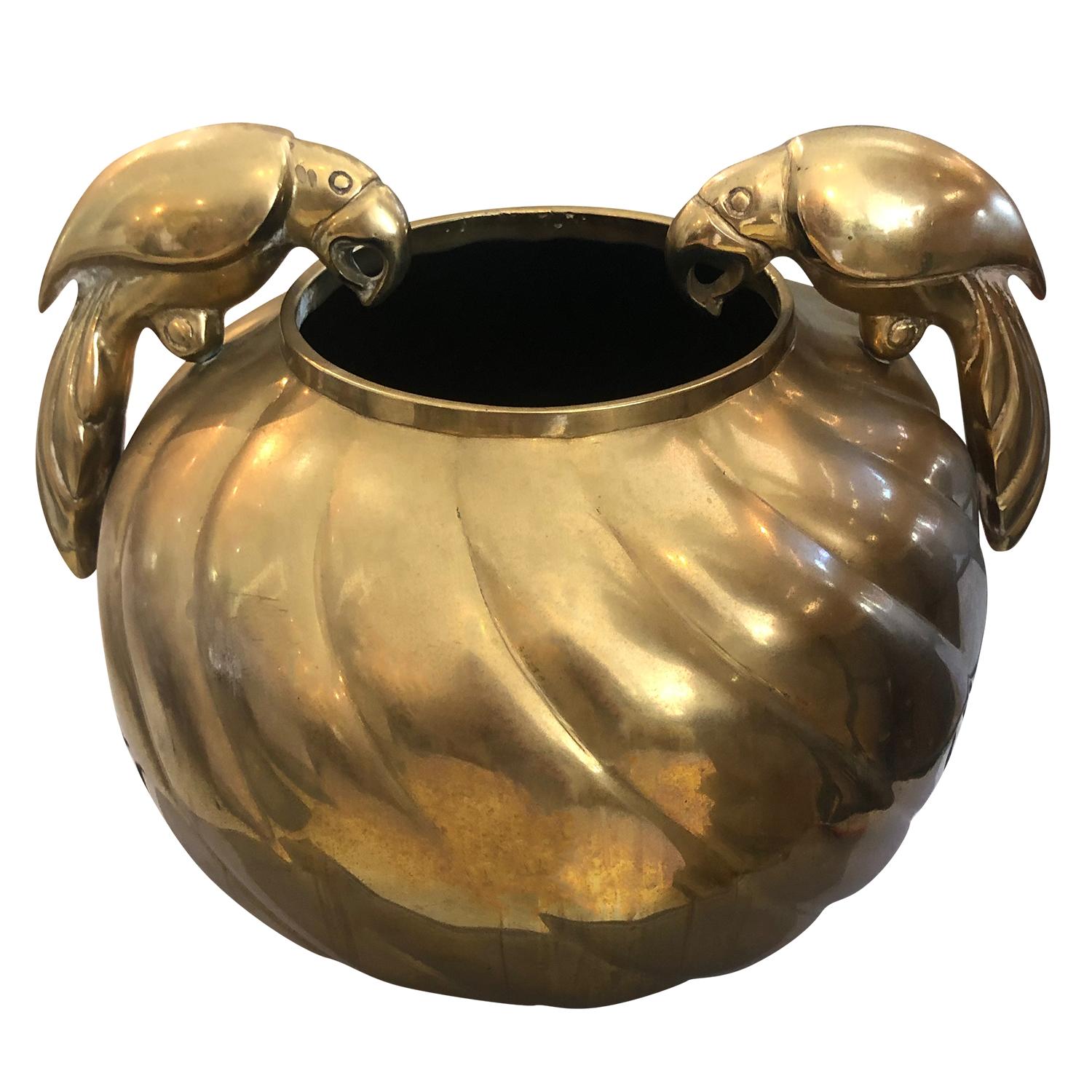 A vintage Mid-Century Modern American ribbed vase made of brass, the lines are softly carved, and set against to the Stark edges. Decorated with two parrots in the manner of Sergio Bustamante, in good condition. Wear consistent with age and use,