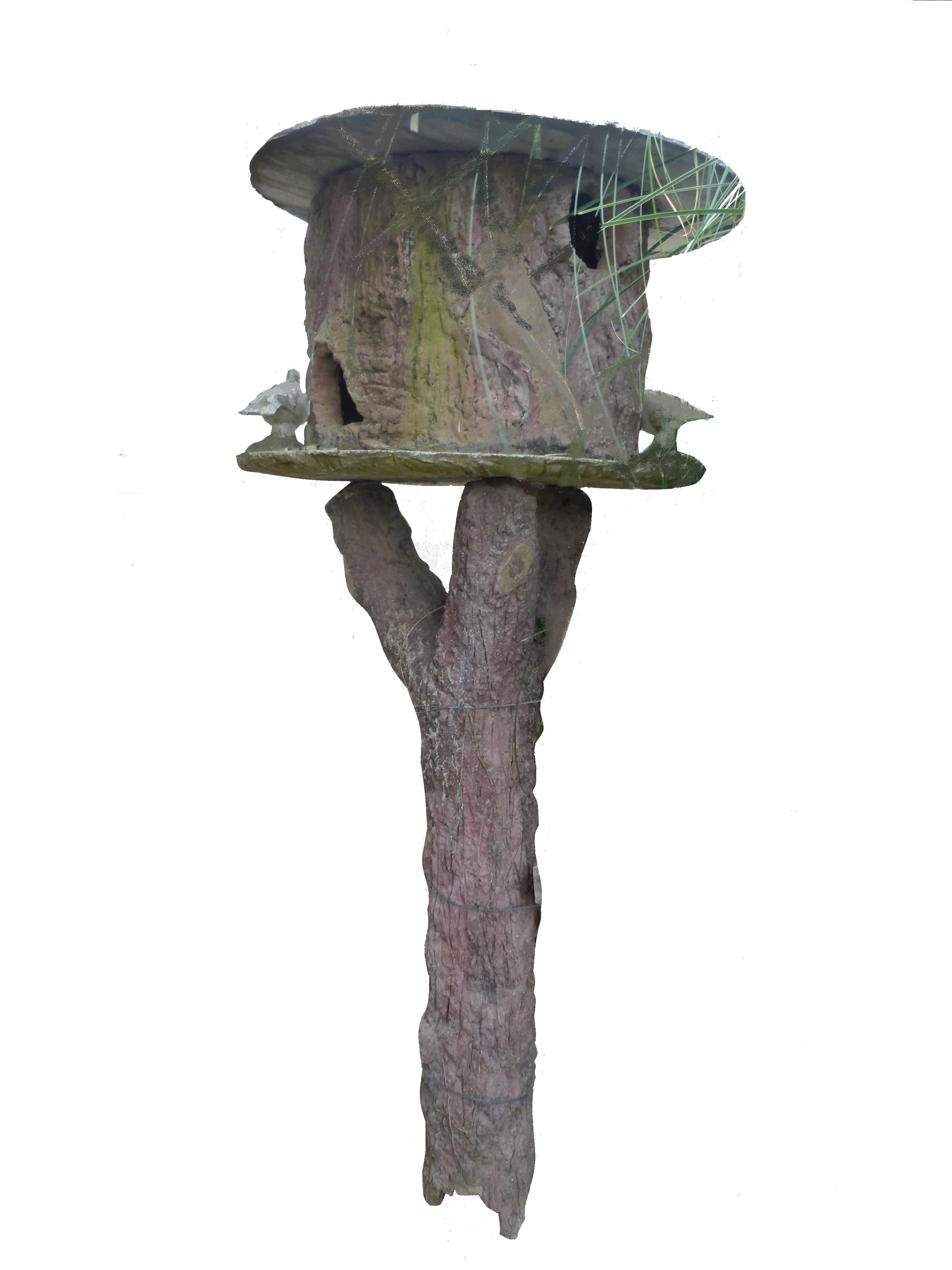 This decorative Pigeon House is made of a light pink tone cement. It is hand carved imitating the tree's trunk that holds the Pigeon's House, which is also made with carved cement, emulating wood.
Nowadays, this cement decorative garden objects are