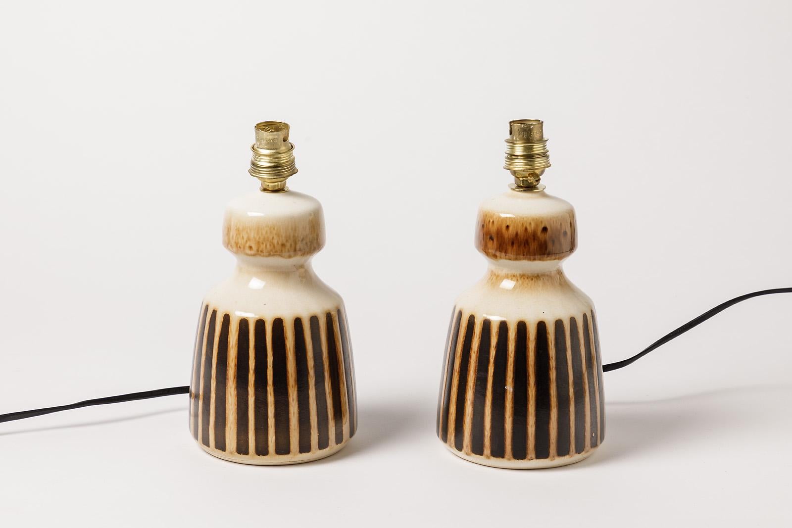 Susex England

Decorative brown and white pair of ceramic table lamps by susex

circa 1970 realised in England

Original perfect conditions

Ceramic dimensions: height 19 cm Large 12 cm
With electric system: height 24 cm.