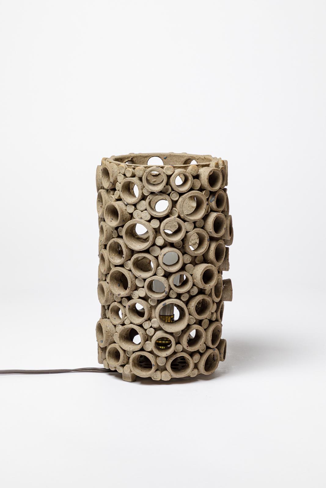 Unique handmade table lamp - France


Realised circa 1970

20th century design perforated stoneware ceramic table lamp
Architectural form

Original perfect condition

electrical system is ok

Height 25 cm
Large 15 cm
