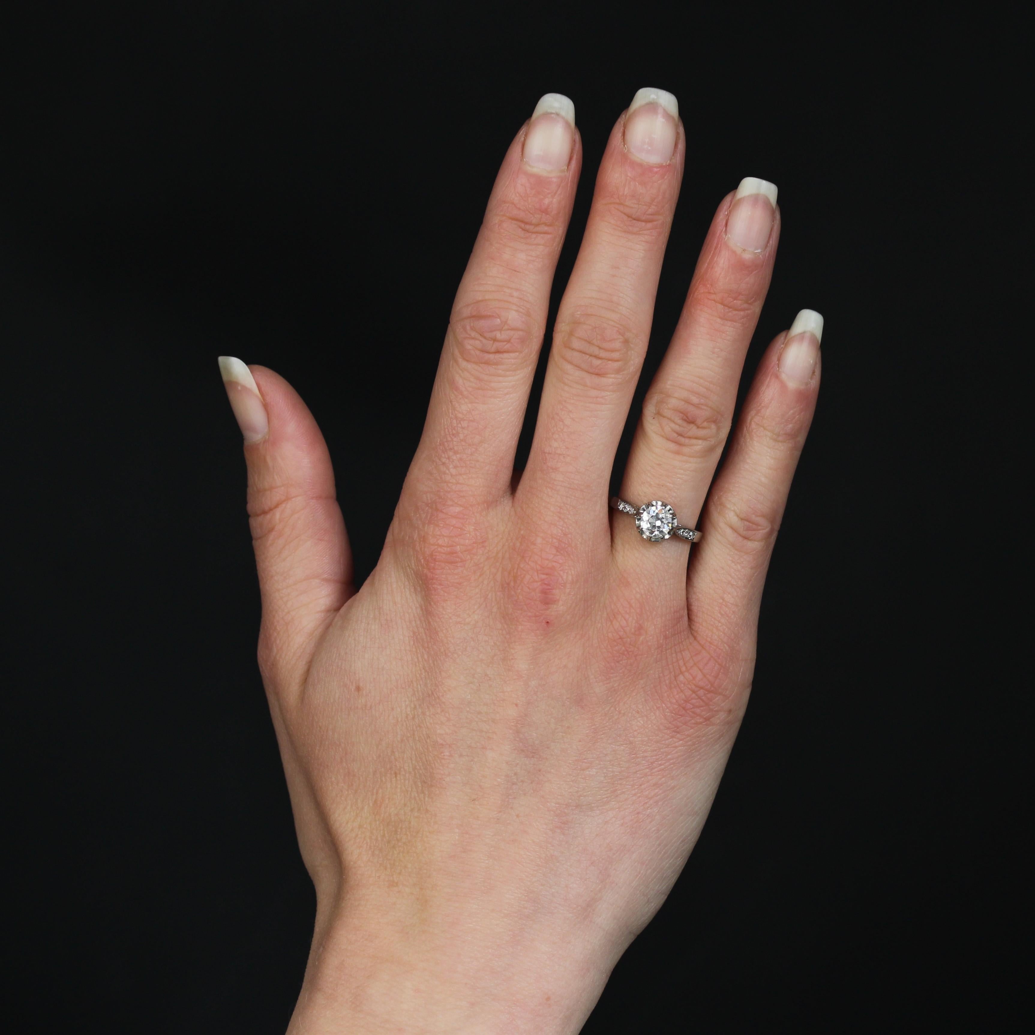 Platinum ring.
Antique diamond solitaire, set in an illusion claw setting, holding an oval antique-cut diamond. On either side of the head, the start of the ring is adorned with 2x3 8/8-cut diamonds.
Weight of the main diamond : 0.74 carat