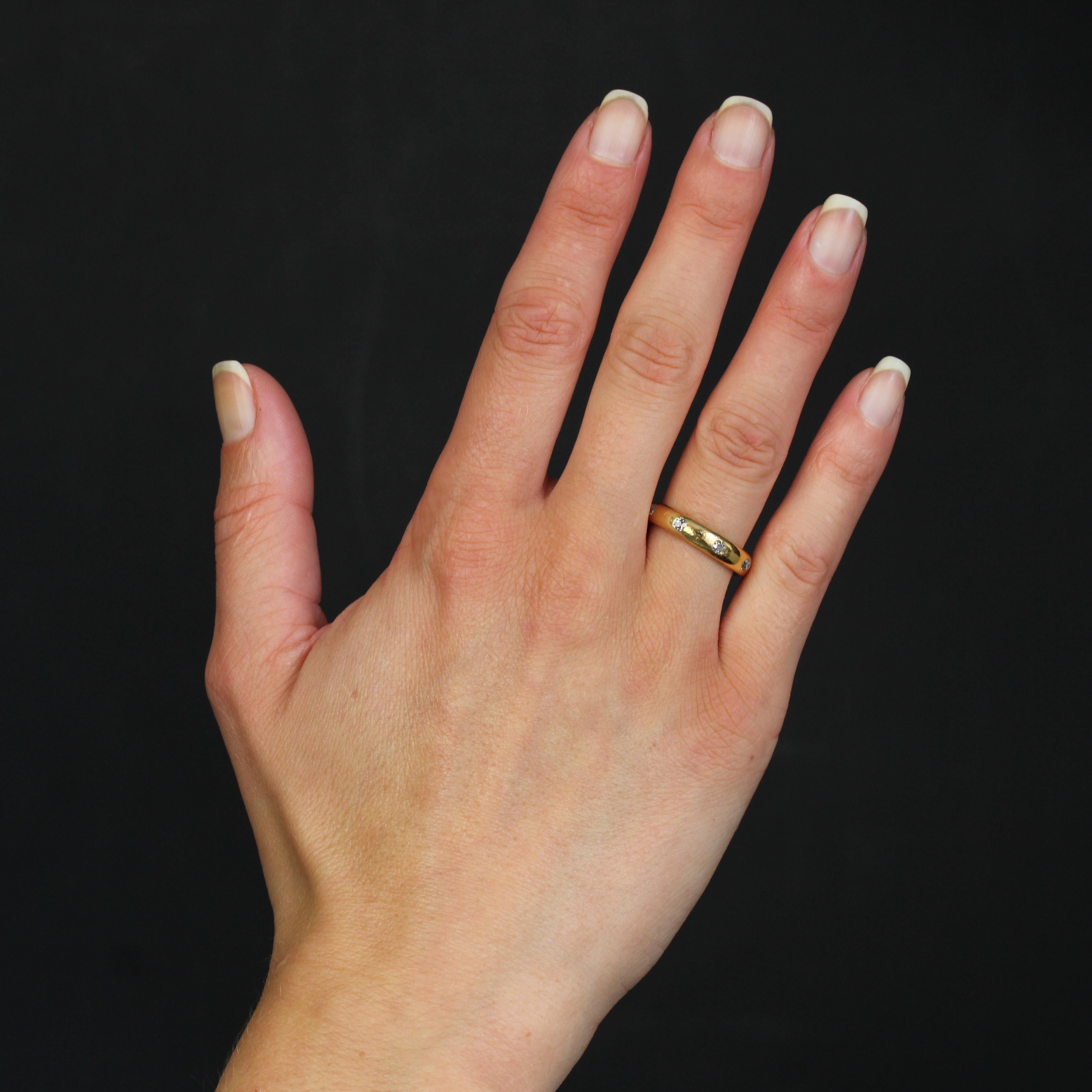 Ring in 18 karat yellow gold.
This elegant antique wedding band features a thick, slightly domed ring set with 8 cushion-cut diamonds.
Total diamond weight : 0.50 carat approximately.
Height : 4.1 mm approximately, thickness : 2.6 mm