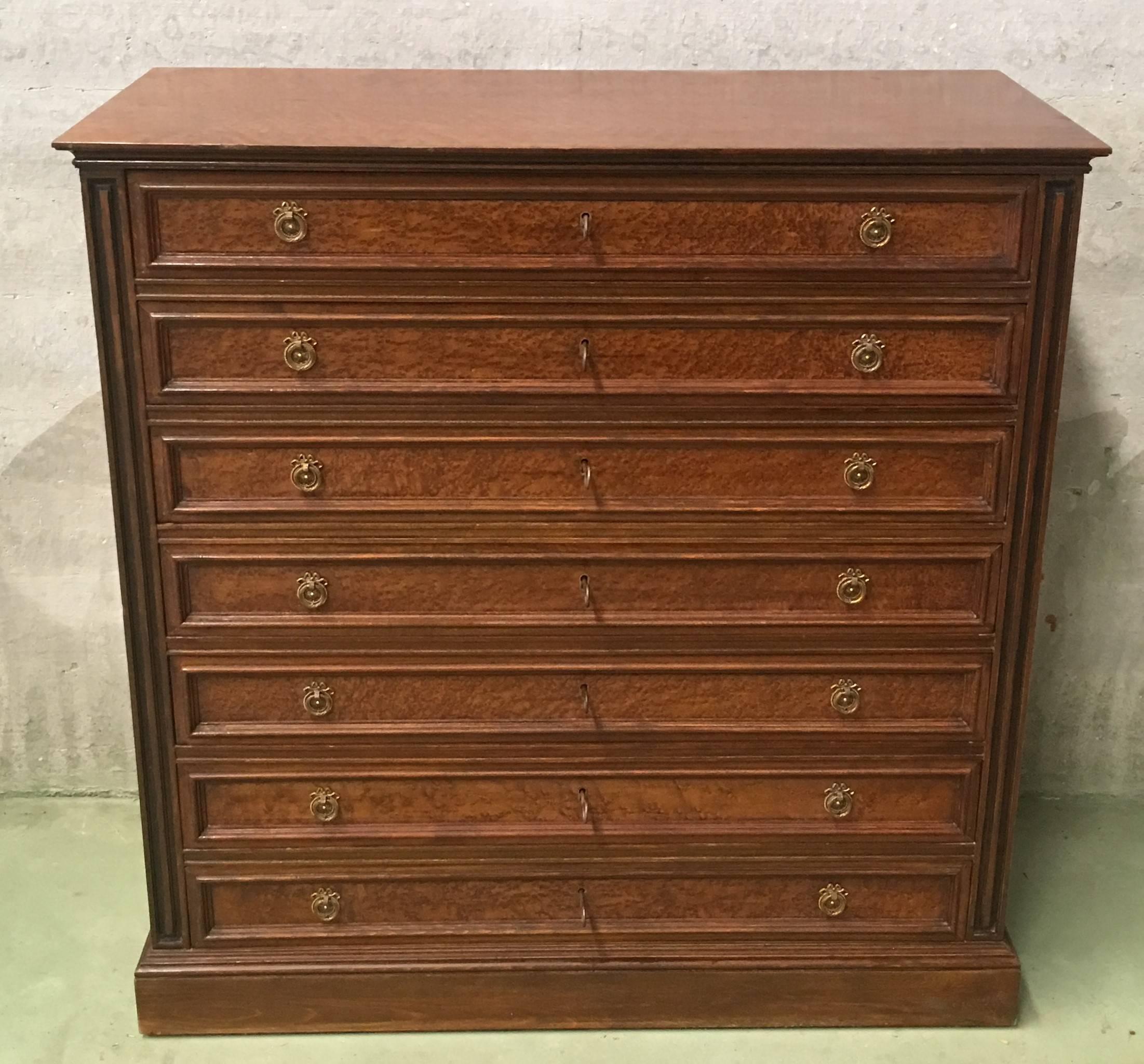 Seven-drawered French chest of drawers or Semainiere, dresser. The chest shows fluted three-quarter columns on the corners and a beautiful walnut.