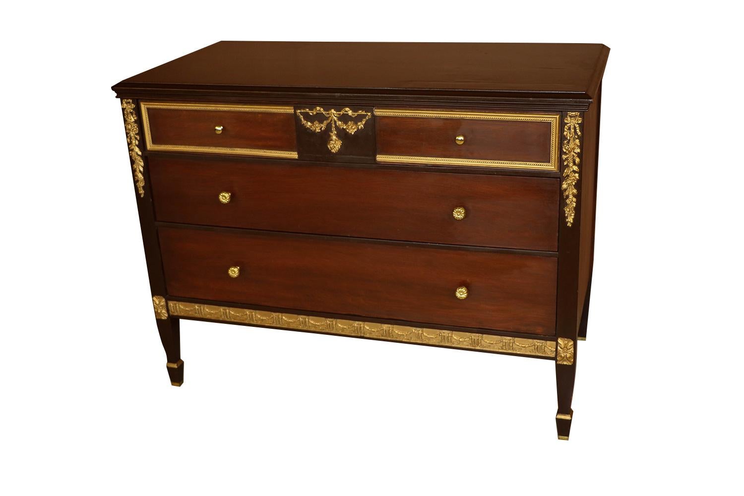 Gorgeous three-drawer mahogany dresser, chest of drawers by Sligh, mid-20th century, Louis XVI Style. Features rectangular top, above three drawers, fitted with polished brass pulls, and beautiful gilt accents, interior of drawer with manufacturers