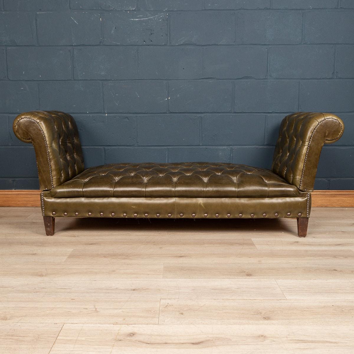 A very unusual leather day bed or window seat. Made in the latter part of the last century, this wonderful piece of furniture has been hand crafted in England by an excellent furniture maker. Both the seating area and the armrests with buttoned down