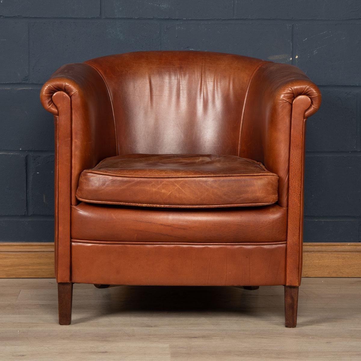 Showing superb patina and colour, this wonderful tub chair was hand upholstered sheepskin leather in Holland by the finest craftsmen in the latter part of the 20th century.

CONDITION
In good condition - some wear consistent with normal use,