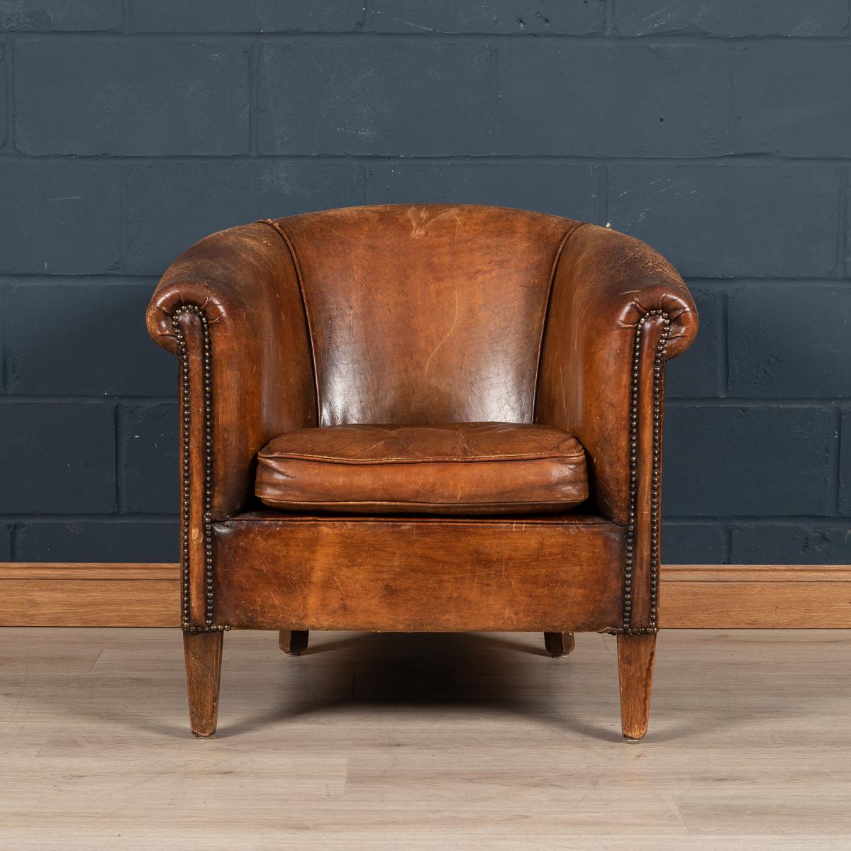 Showing superb patina and colour, this wonderful tub chair was hand upholstered sheepskin leather by Nico Van Oorschot, one of the finest craftsmen of sheepskin leather in Holland. Fantastic look for any interior, both modern and traditional.

 