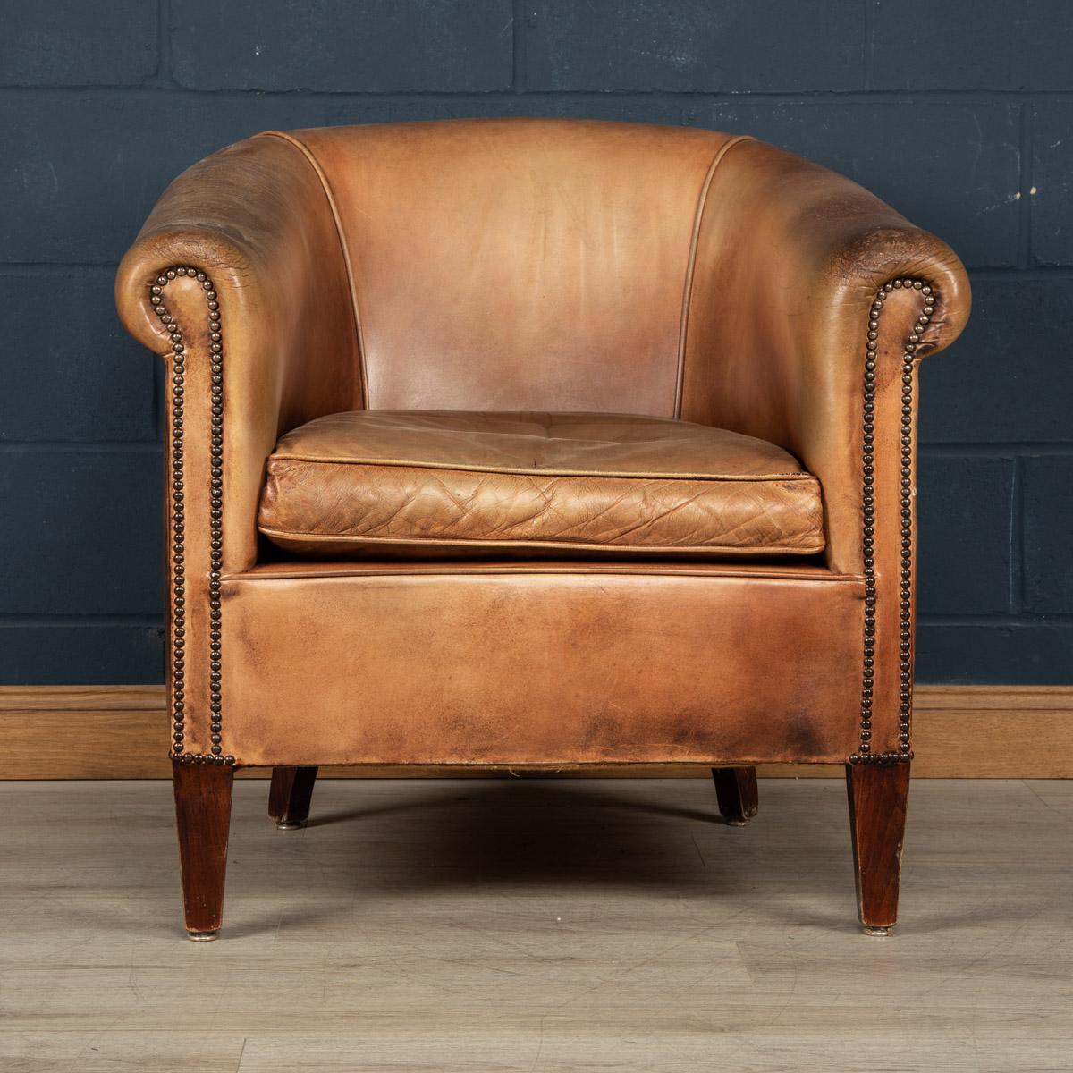 Showing superb patina and colour, this wonderful club chair is a slightly “oversized“ version and was hand upholstered in sheepskin leather in Holland by the finest craftsmen.

Condition
In Good Condition - some wear consistent with normal use.