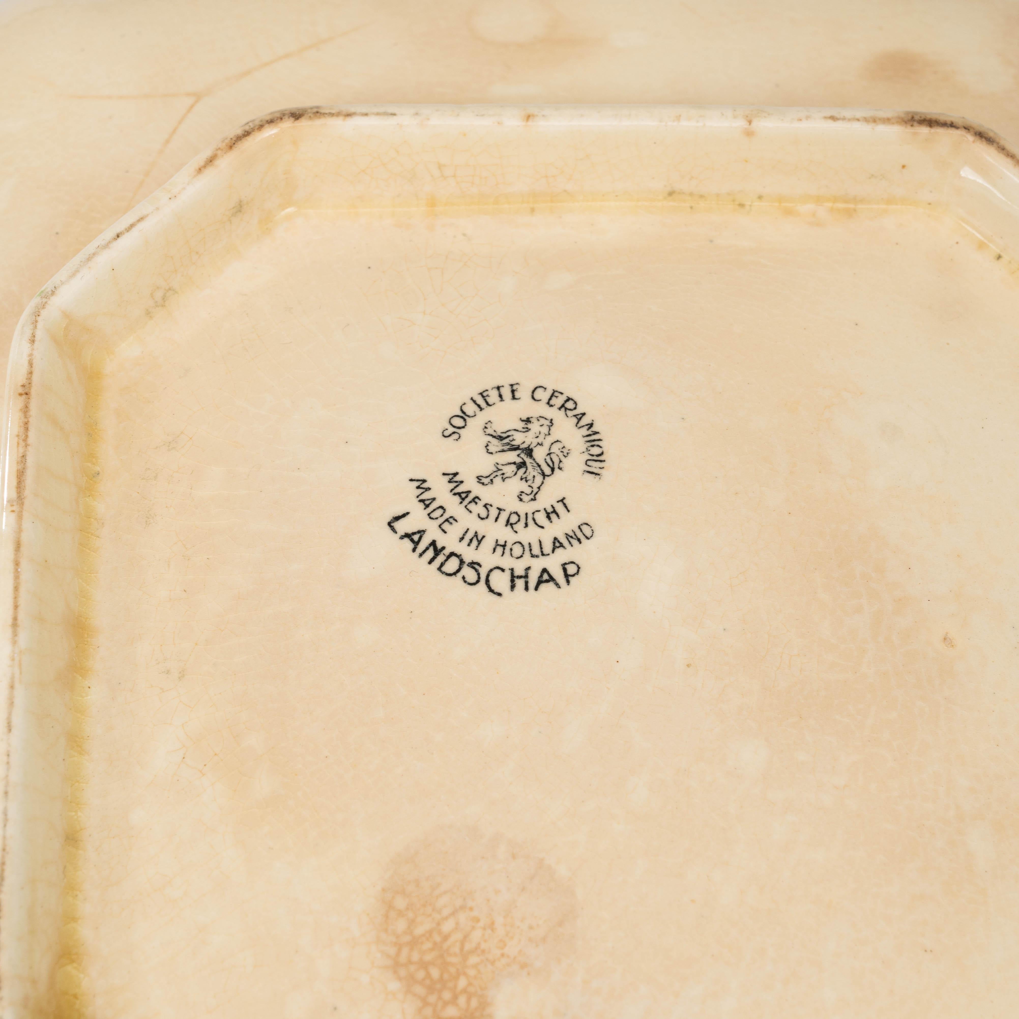 This 20th Century Dutch Special Edition Porcelain Tureen Without Lid reflects the enduring charm of European ceramic artistry. Made of creamy glazed porcelain, it features finely detailed black pastoral scenes transfer-printed along its gently