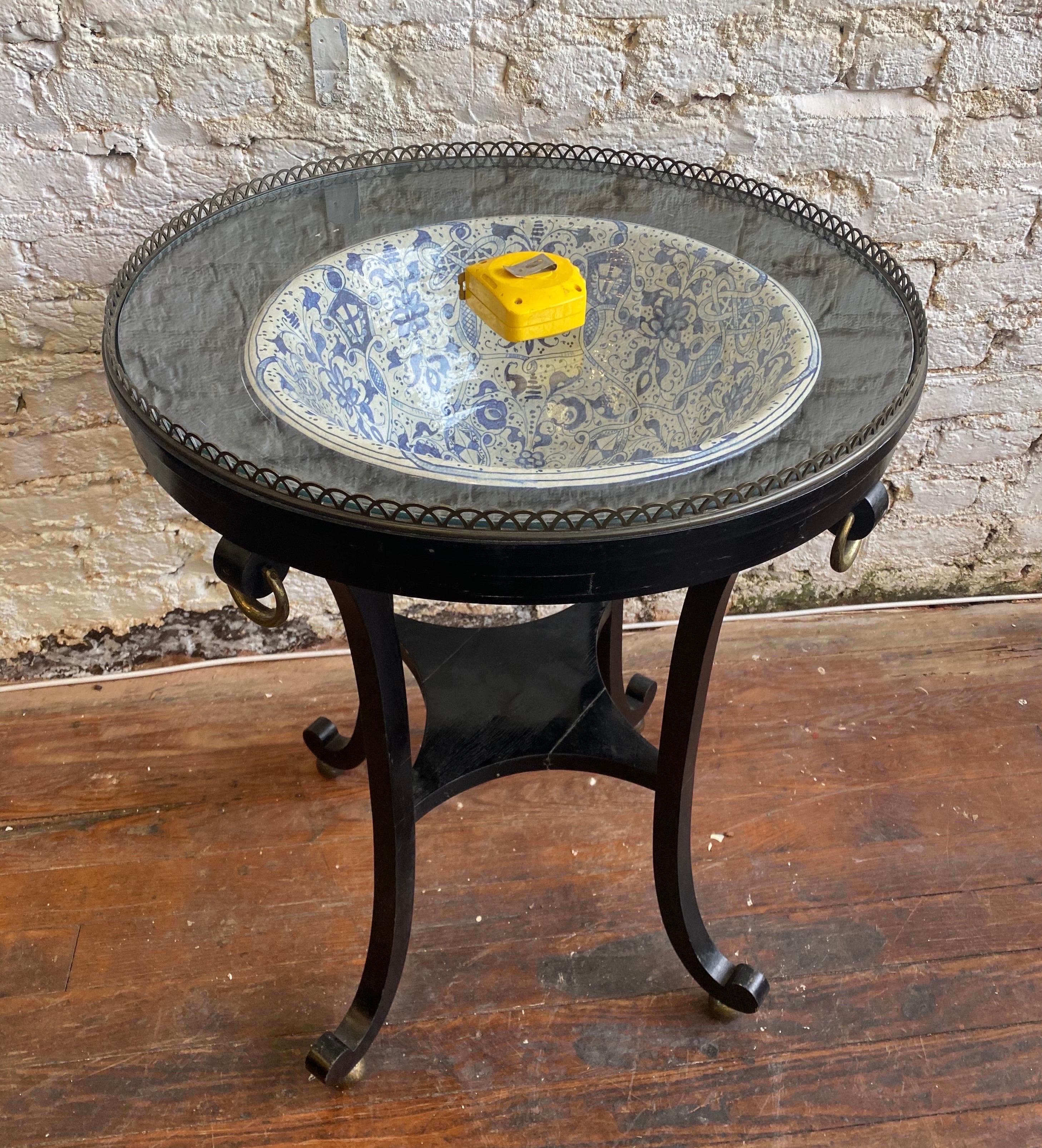 20th century ebonized table with porcelain bowl from Mario Buatta estate.