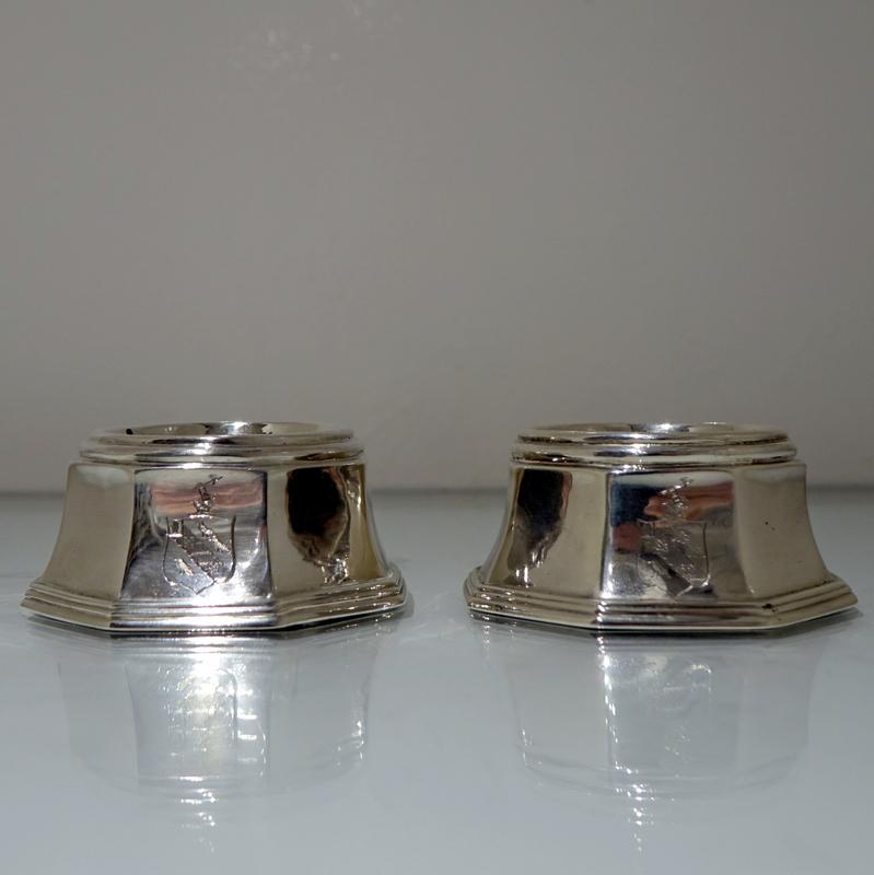 A stylish set of eight plain formed octagonal Britannia silver salt cellars decorated with elegant armorials to their centre fronts.

 

Weight: 30 troy ounces/938 grams

Measures: Height: 1.5 inches/3.8cm

Diameter: 3.5 inches/9cm.