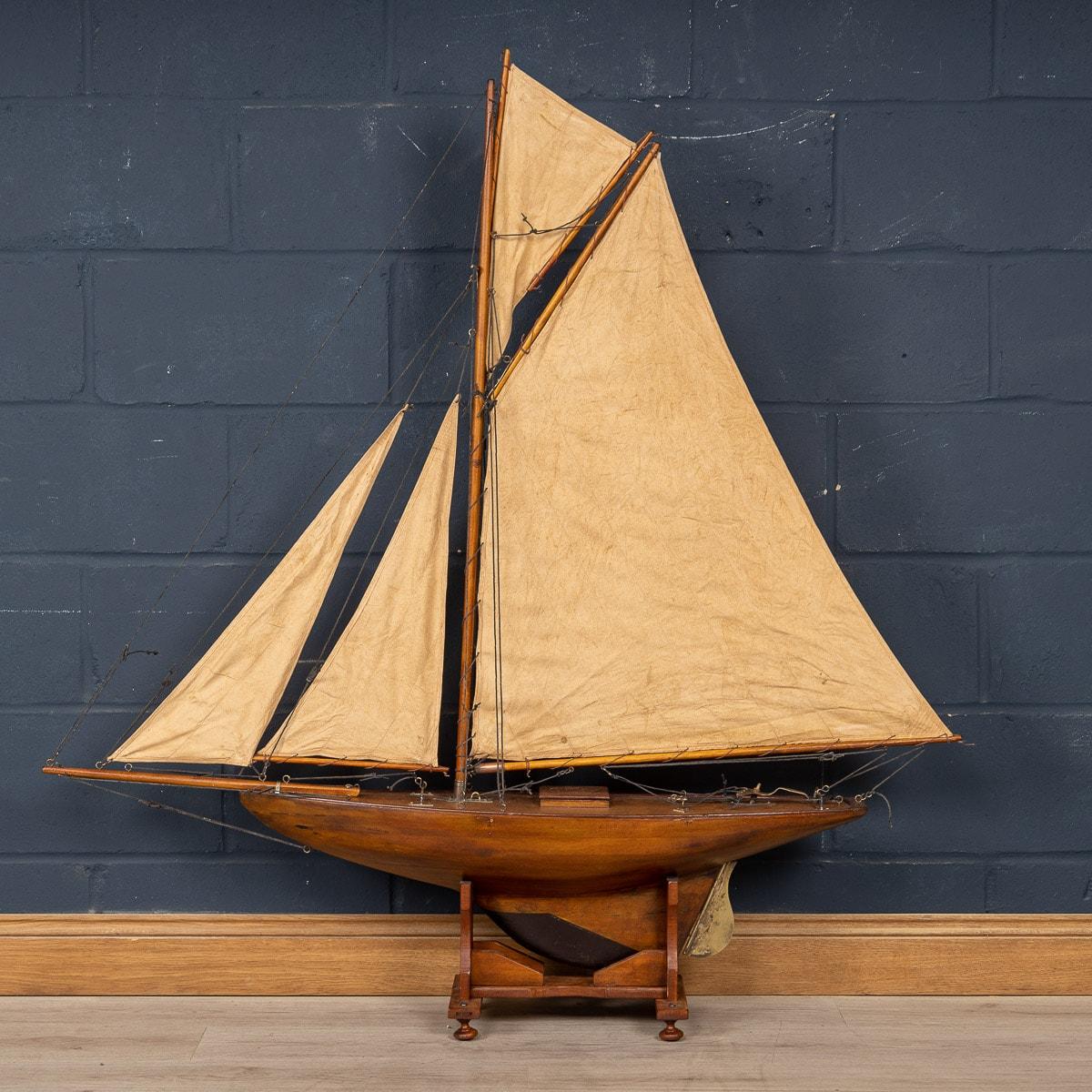 A fantastic antique Gaff Cutter pond yacht, lovely “bread and butter“wood hull construction dating to the first half of the 20th century. Bread and butter construction is when planks of wood are stacked on top of each other (the bread) and then