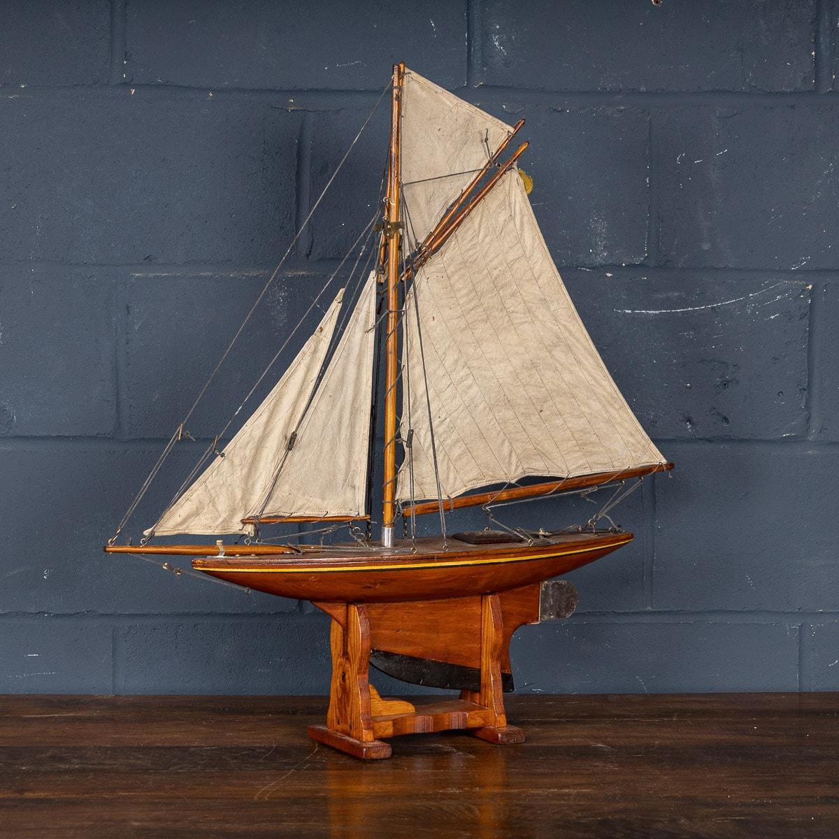 A charming antique gaff rigged cutter pond yacht, lovely carved wood hull dating to the first half of the 20th century. The yacht is an example of British pond racing yacht and would have raced against similar yachts in competitions, club against