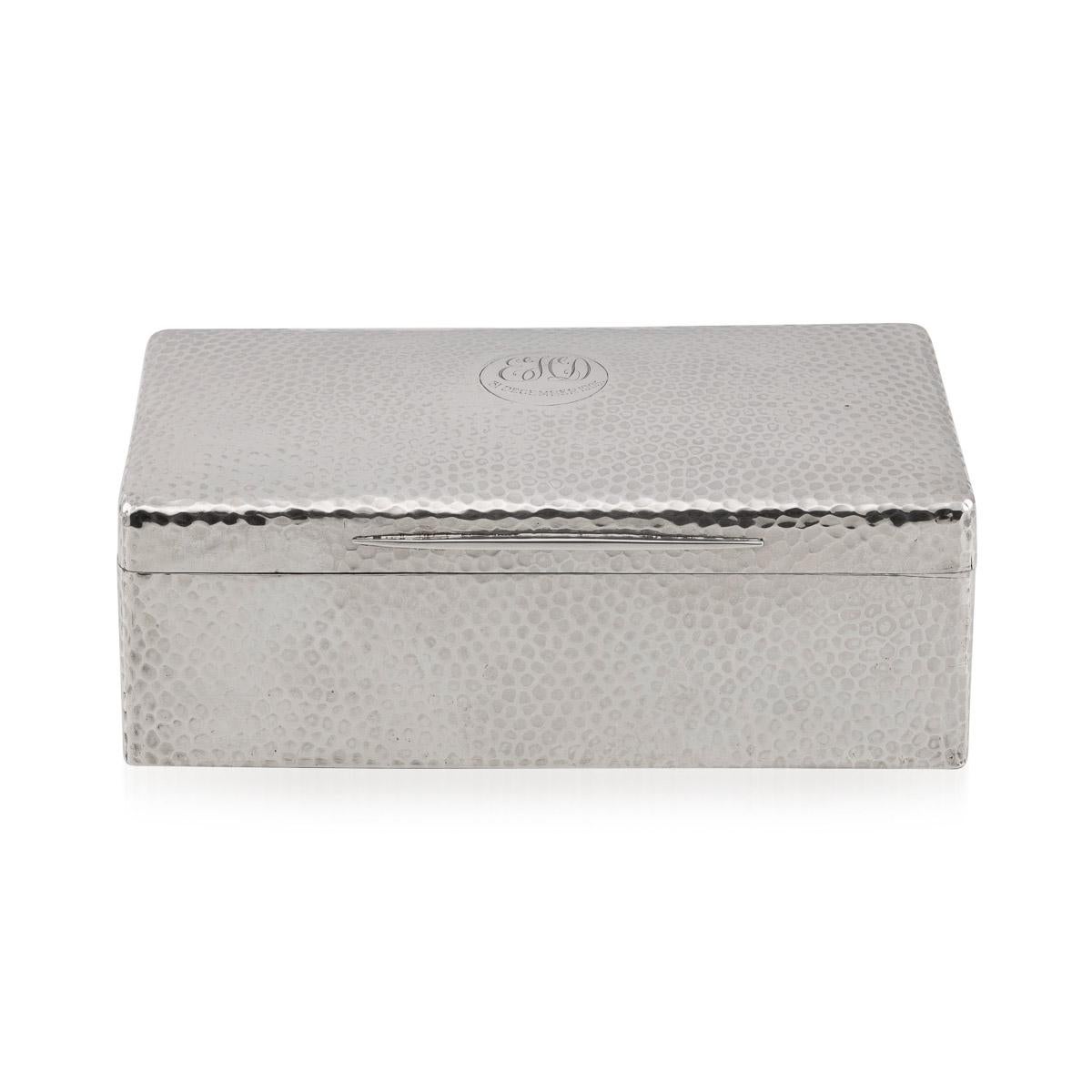 Antique 20th Century Edwardian solid silver stylish cigar box, rectangular-shaped, hand hammered, textured silver with a wood lined interior. Hallmarked with English silver marks (925 standard), Birmingham, year 1906 (g), Maker A&JZ (A & J Zimmerman