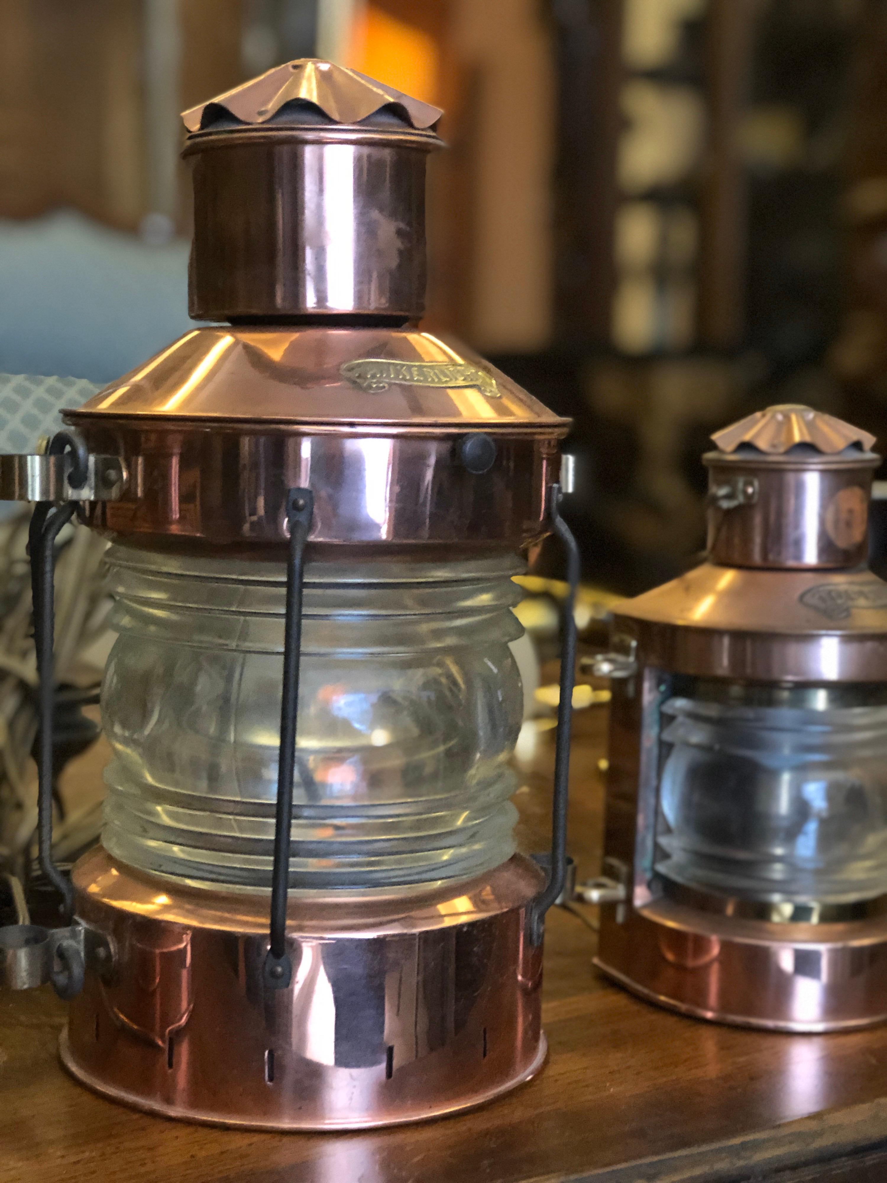 Beautiful vintage copper lanterns - Ankerlicht - one big and one small piece. Vintage Ankerlicht copper ship's lantern from the Netherlands re-purposed into an electric lamp. Features a thick, clear glass 360 degree lens. Hinged top that opens to