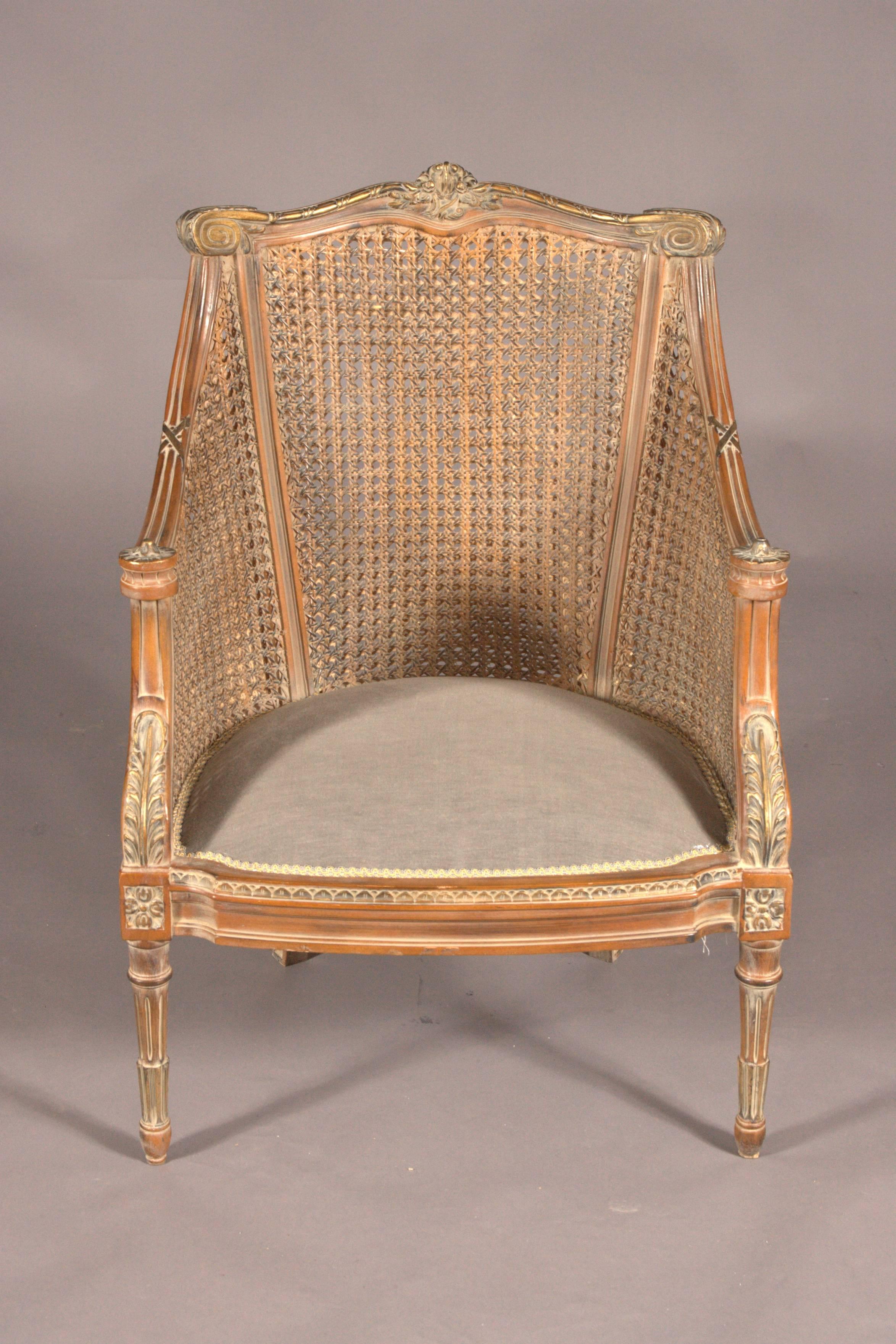 Etruscan decor in English style. Solid beechwood, carved and colored. Slightly scalloped frame on meshed legs. Beveled, flat, slightly rising armrests. Curved backrest frame with center ridge and beaded crown. Seat padded. The back and sides of the